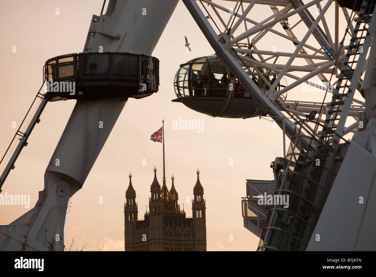 The London Eye on the Thames embankment in London at dusk. Stock Photo