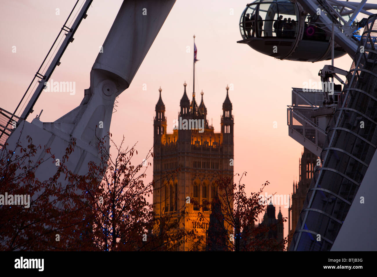 The London Eye on the Thames embankment in London at dusk. Stock Photo