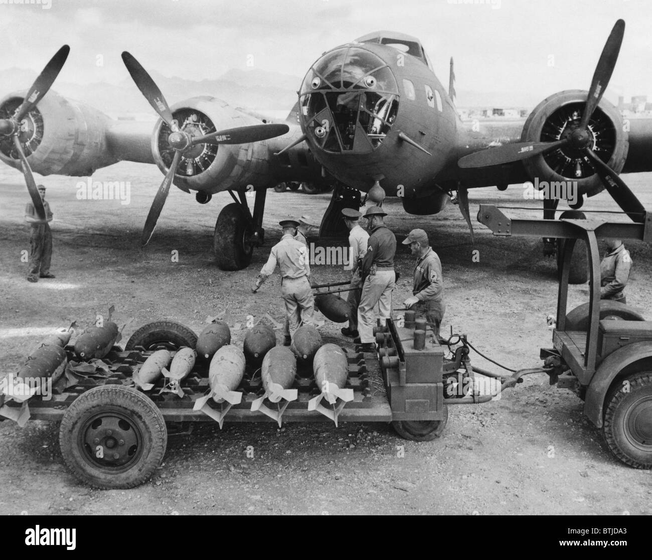 An ordnance crew loading 300 pound bombs into a U.S. Air Force bomber, Hawaii, 1942. Stock Photo