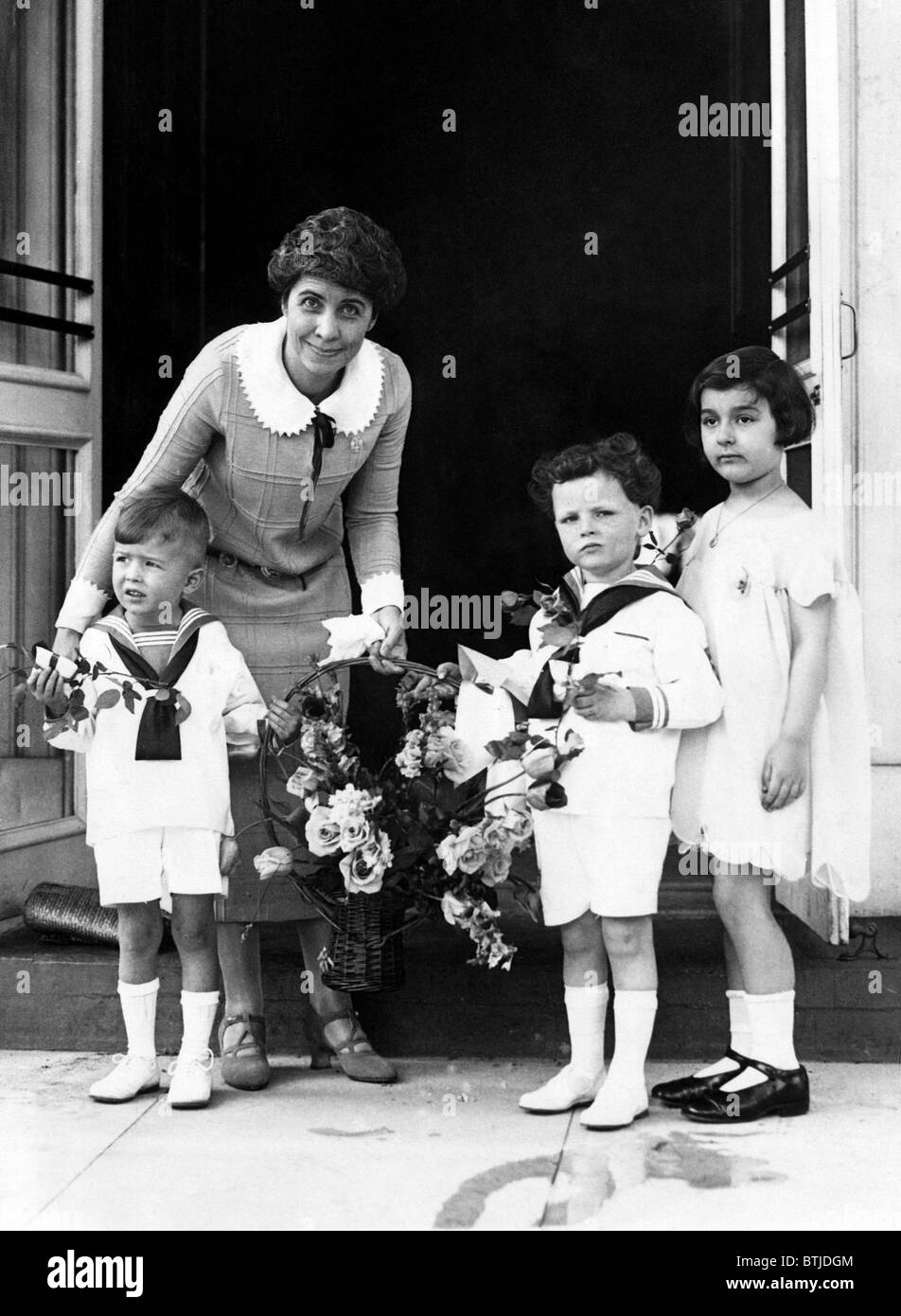 Children give First Lady   Grace Coolidge a basket of flowers, 1925. Courtesy: CSU Archives/Everett Collection Stock Photo