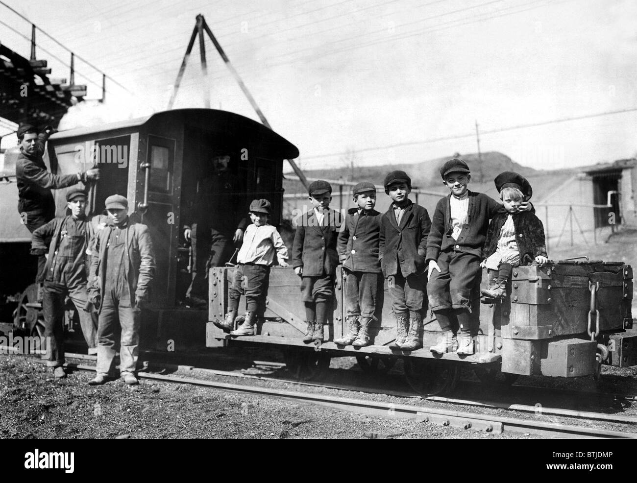 March 19, 1912.  Children of coal miners at Pittaton, Pa., riding on the coal car. Stock Photo