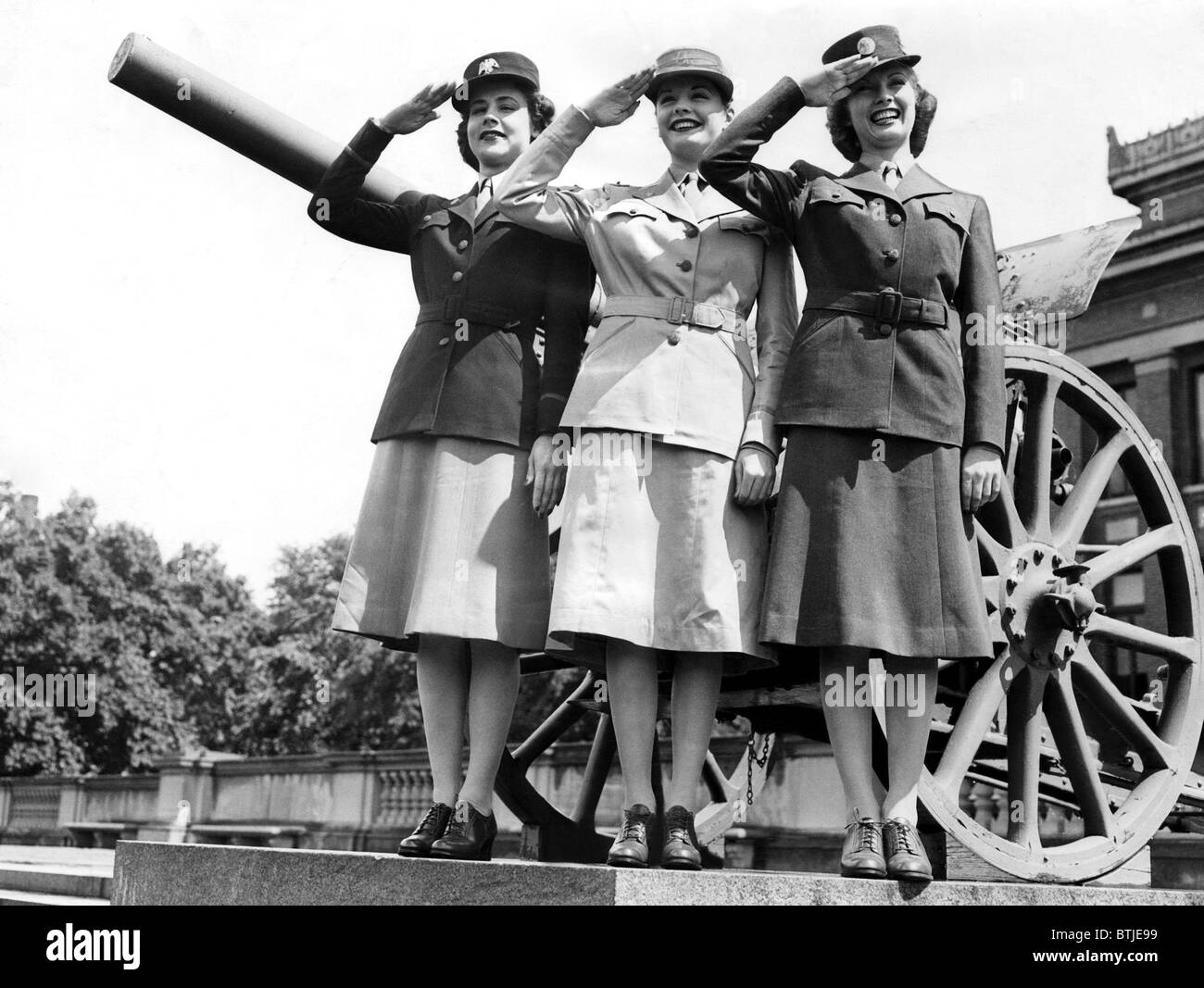 Gloria Pickett, Jane Greer (then Bette Jane Greer), and Inga Rundvold, modeling the uniforms to be worn by the Women's Auxiliary Stock Photo