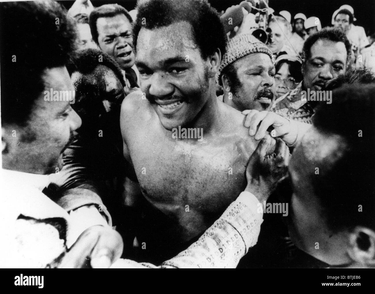GEORGE FOREMAN- The boxer is congratulated in the ring after defeating Joe Frazier for the world heavyweight championship. Kings Stock Photo
