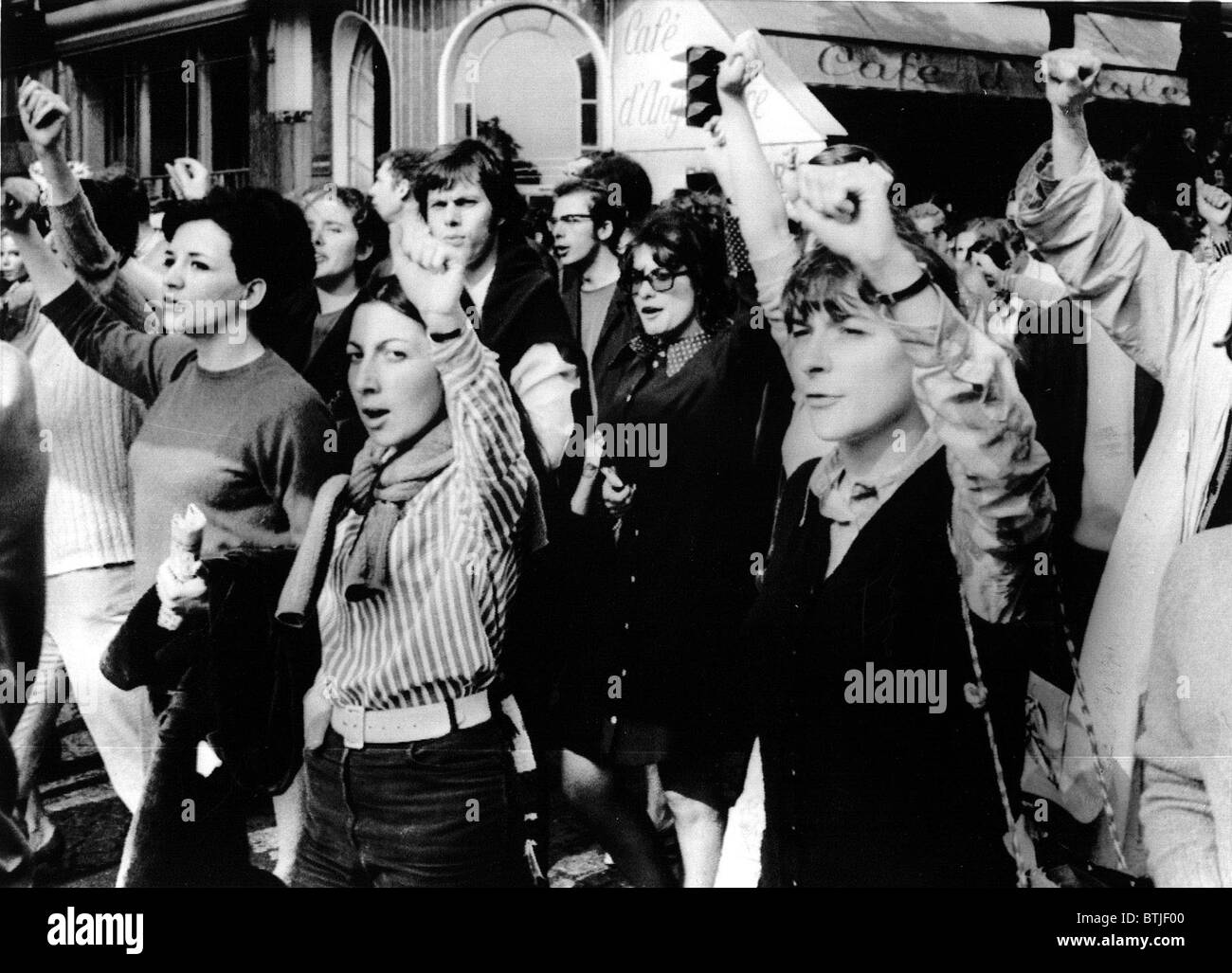 MARCHES-Men & women throw their arms in the air during a march through the streets of downtown Paris for popular government in F Stock Photo