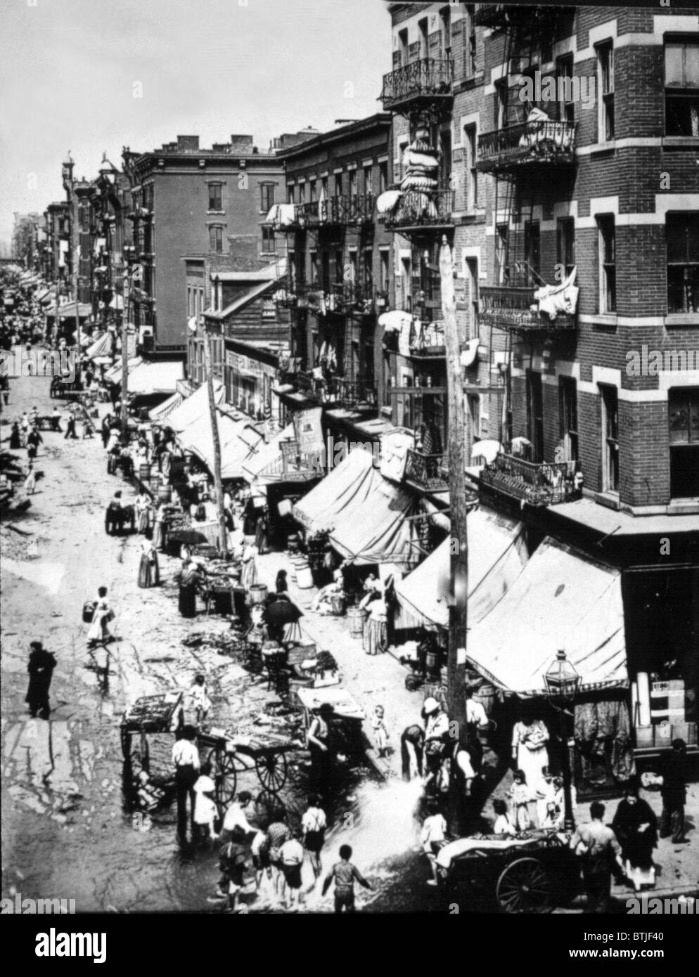 NEW YORK CITY, Immigrants on the summer streets of the Lower East Side, early 1900's. Stock Photo