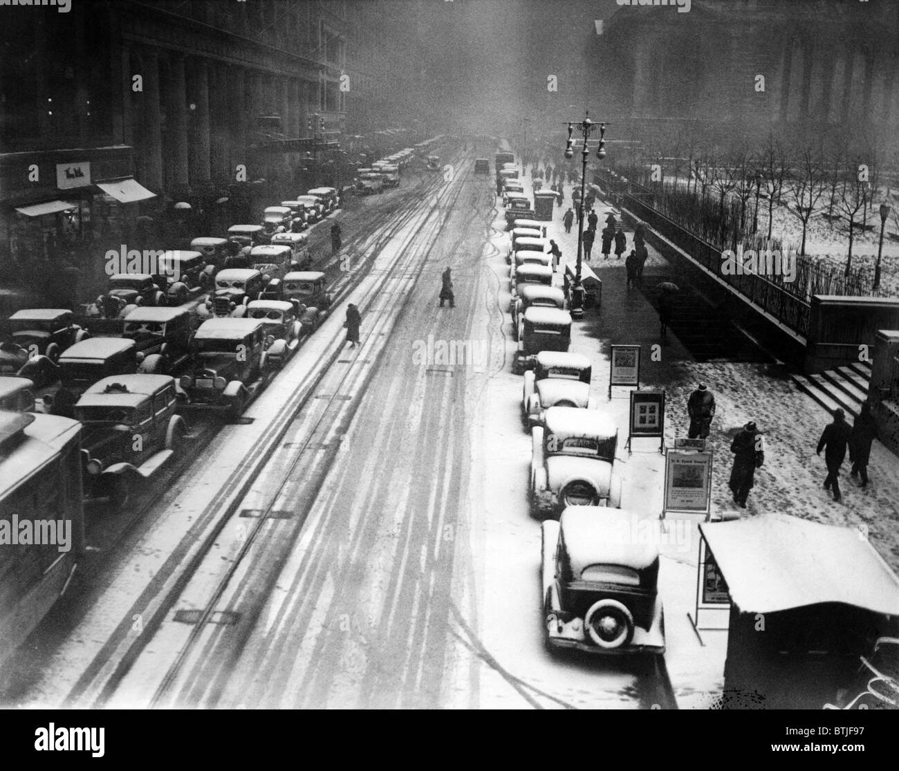 A heavy snowfall, 42nd Street, looking east from 6th Avenue, New York City, January 22, 1935. CSU Archives/Courtesy Everett Coll Stock Photo