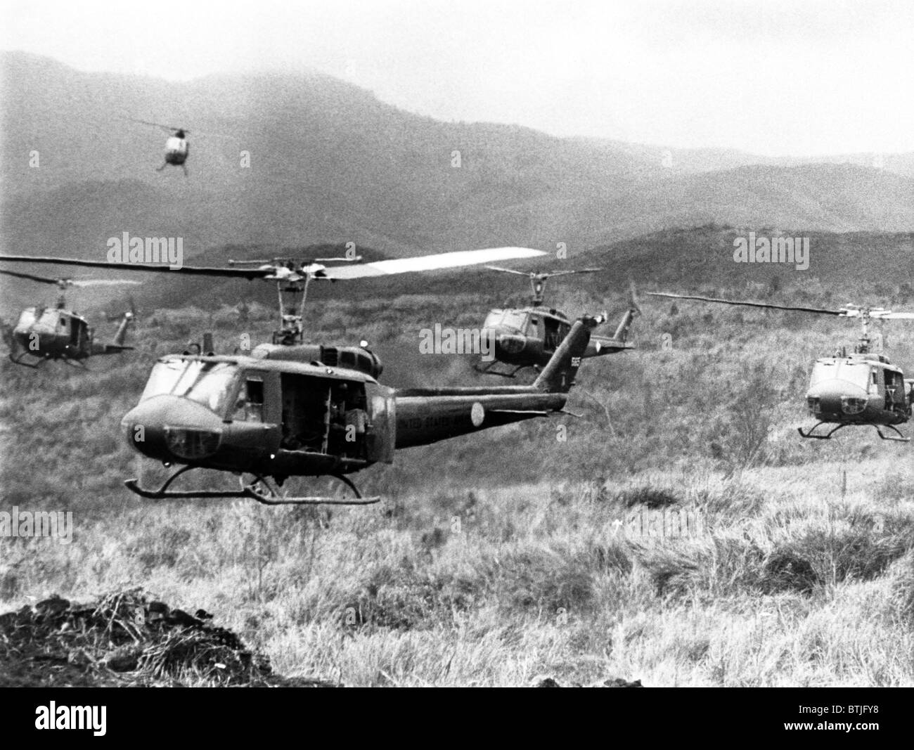 Vietnam War, American helicopters leaving staging area of Khe Sanh to carry South Vietnamese paratroopers to advance positions i Stock Photo