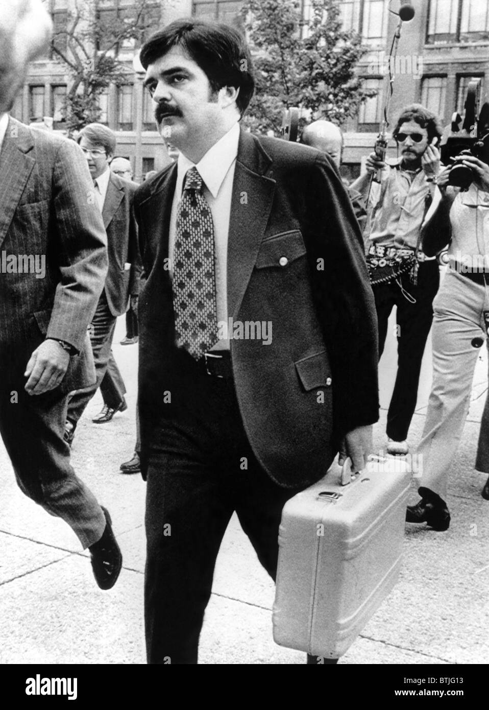 Secret Service Agent arriving at U.S. District Court with 13 additional tapes of Pres. Richard Nixon's Watergate cover-up, Augus Stock Photo