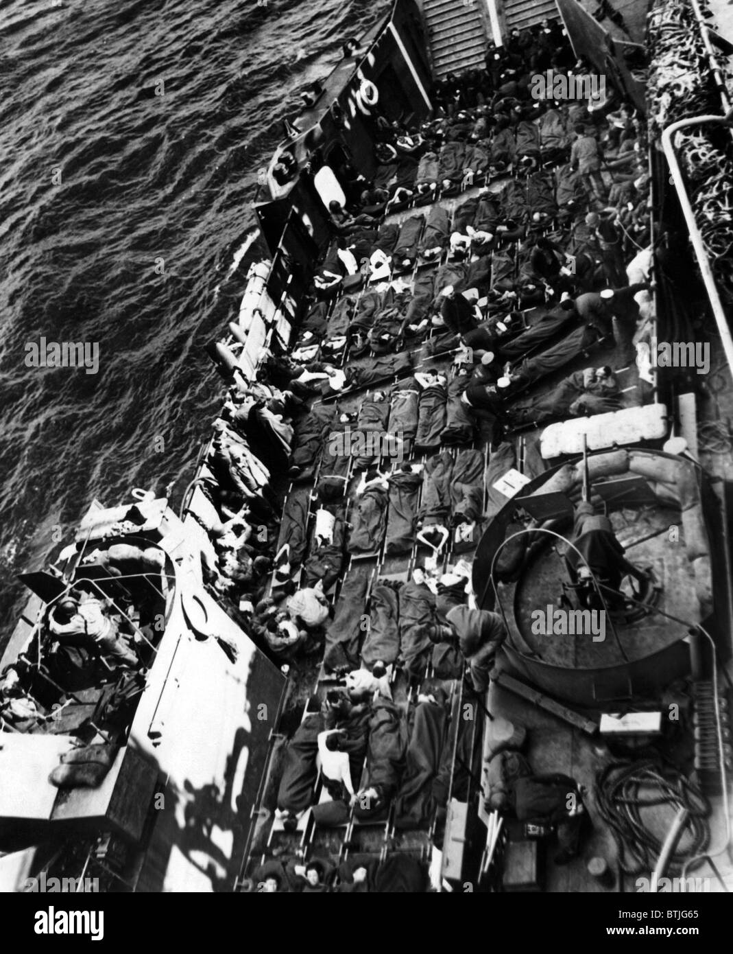 Wounded U.S. and British soldiers being taken away from the capture of Cherbourg, June 28, 1944. CSU Archives/Courtesy Everett C Stock Photo