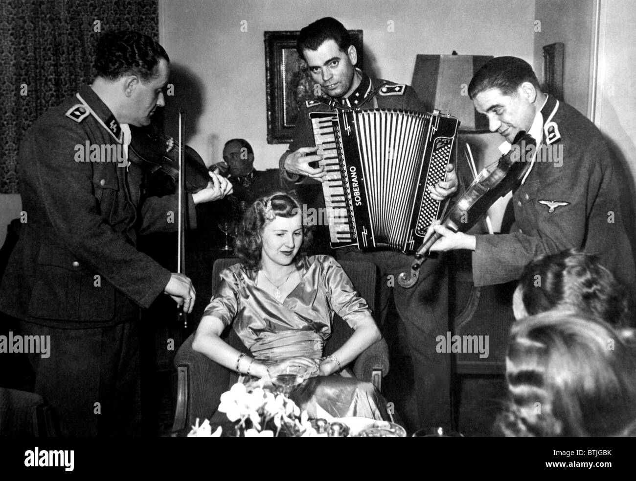 SS musicians play to Eva Braun at her sister's wedding. ca. 1945. Courtesy: CSU Archives/Everett Collection Stock Photo