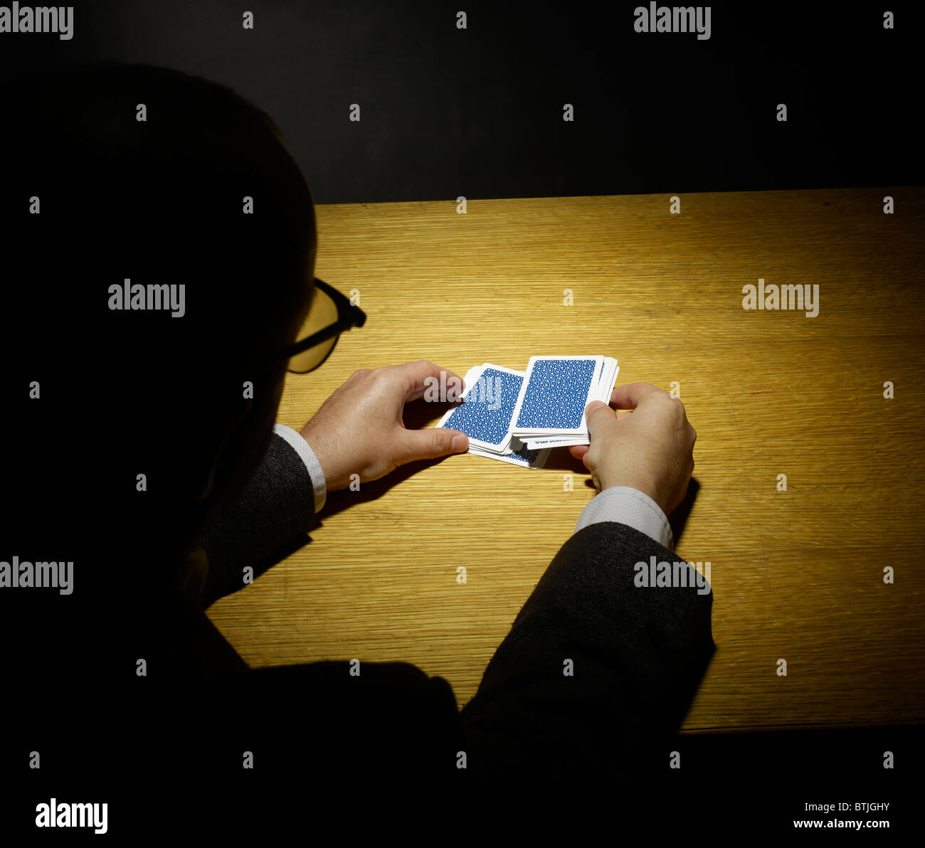 Magician doing a card trick Stock Photo Alamy