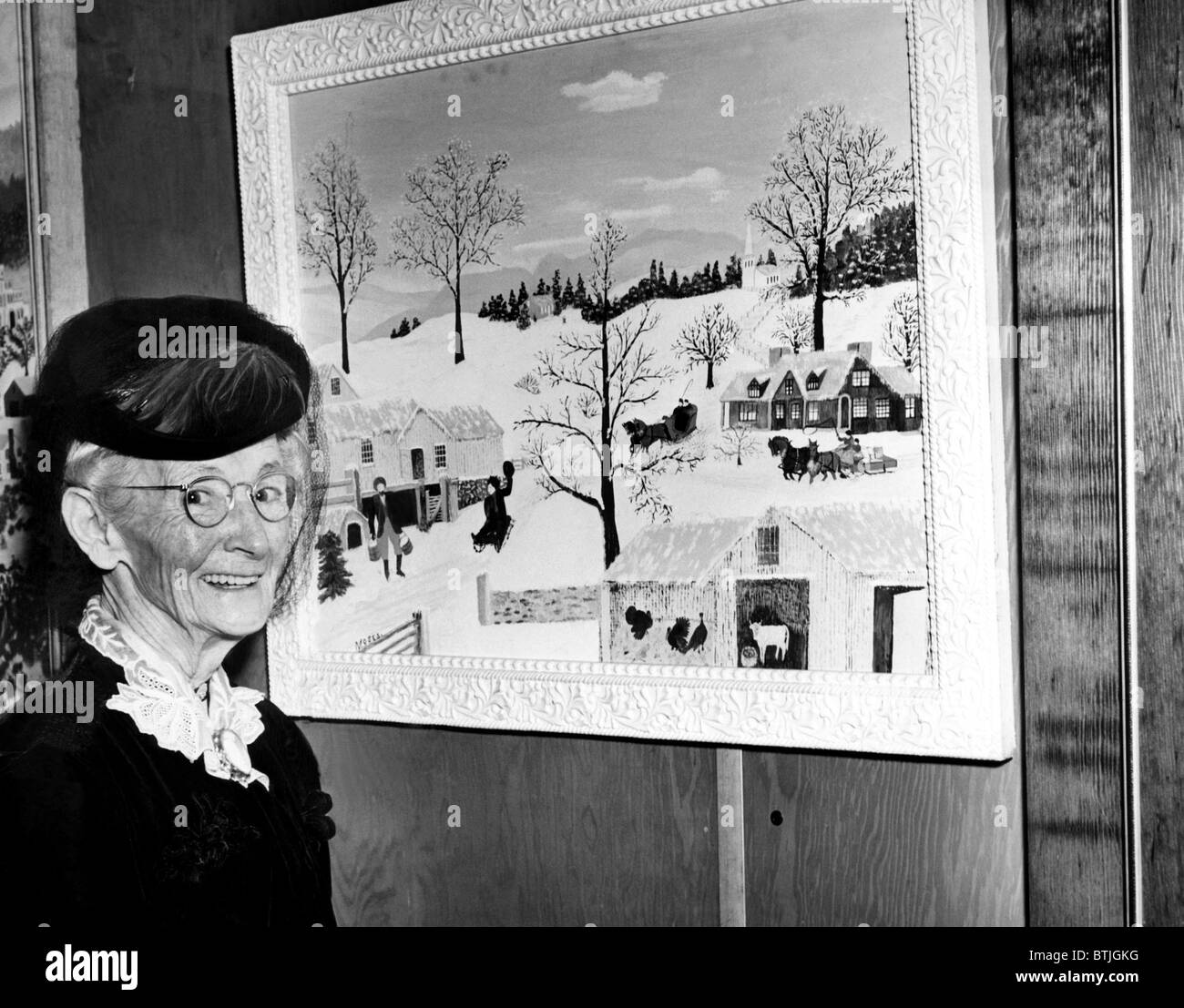 Anna Marie Robertson Moses (AKA Grandma Moses), in front of her painting at the 22nd annual Women's International Exposition of Stock Photo