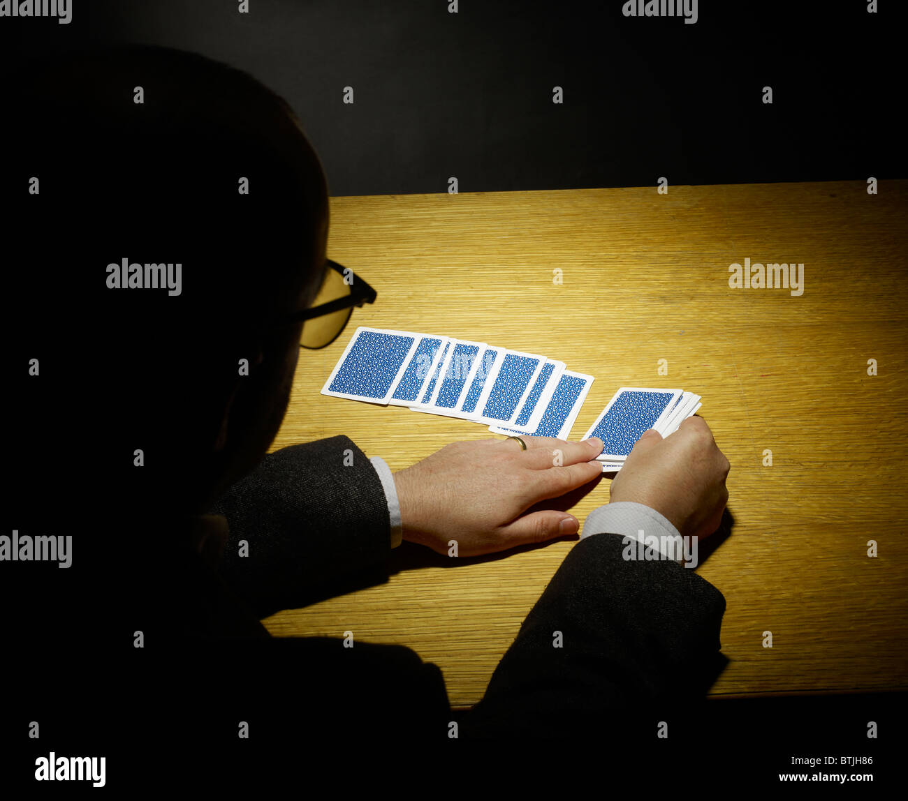 Magician doing a card trick Stock Photo Alamy