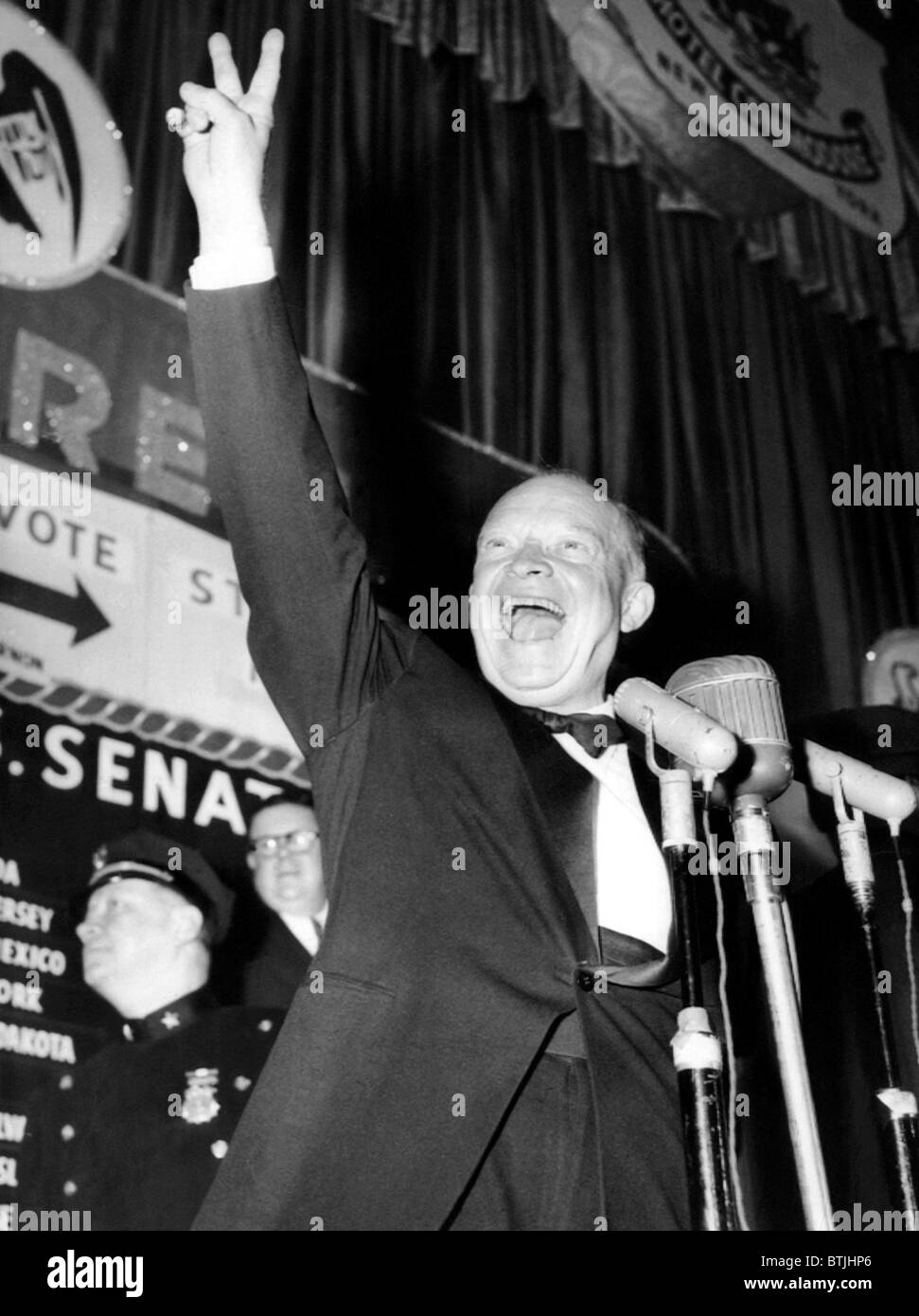 General Dwight D. Eisenhower flashes a victory sign at his Hotel Commodore campaign headquarters after winning the presidential Stock Photo