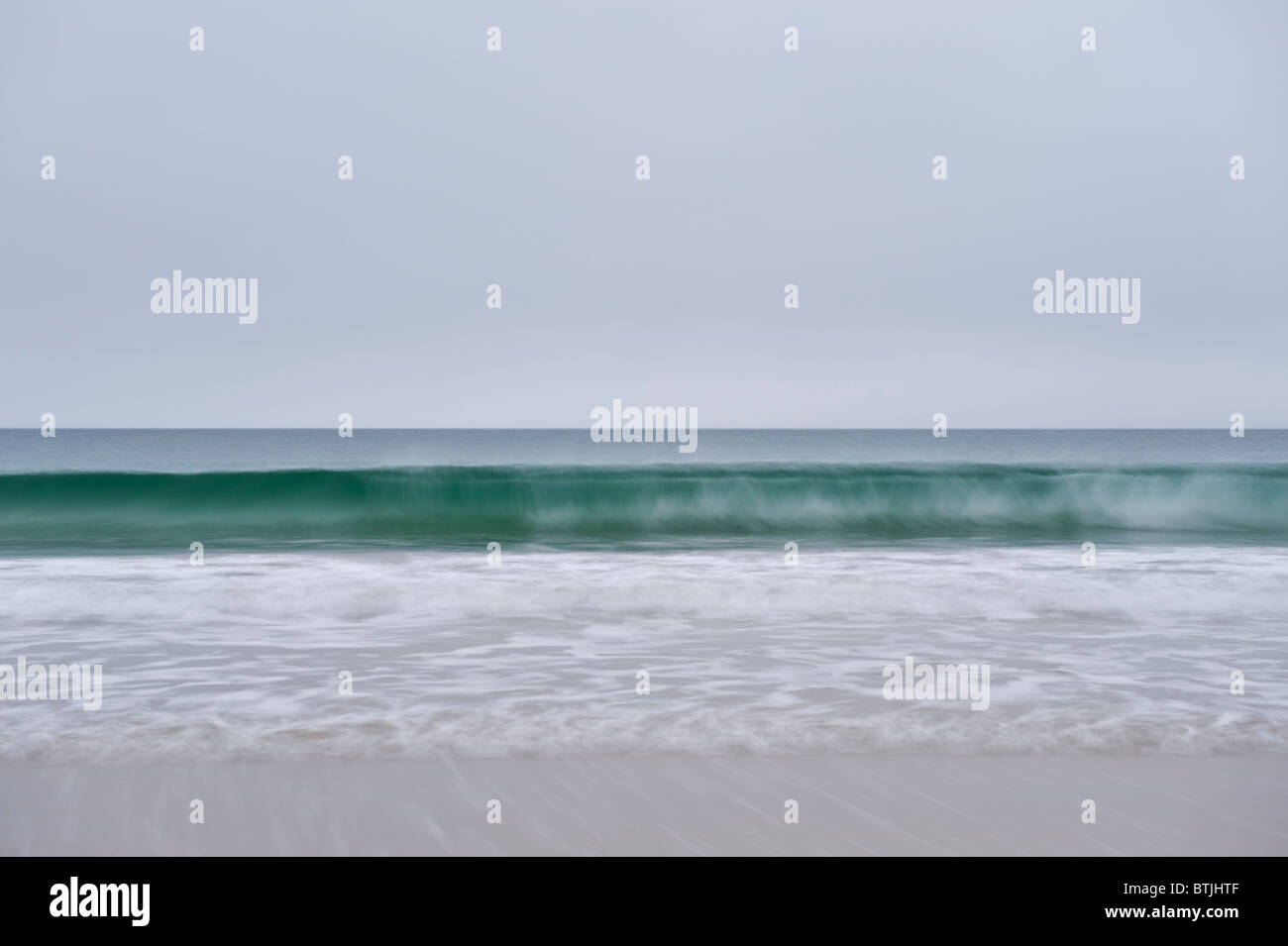 Abstract image of breaking wave in misty weather, Luskentyre beach, Isle of Harris, Outer Hebrides, Scotland Stock Photo