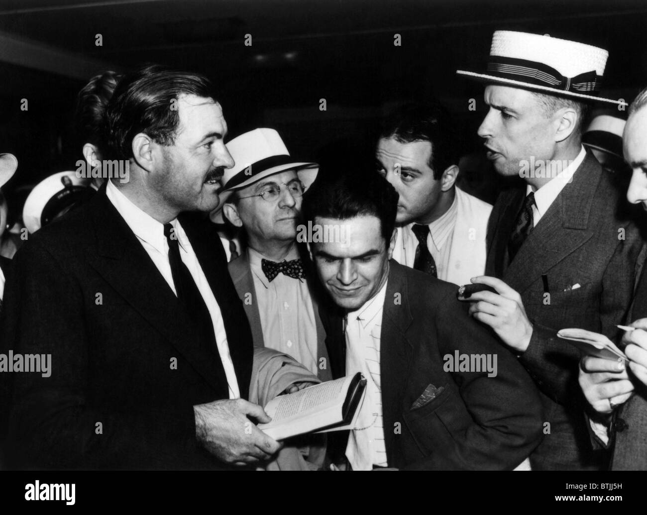 Ernest Hemingway being interviewed in the press before returning to the Spanish Civil War, New York City August 1937.Courtesy CS Stock Photo