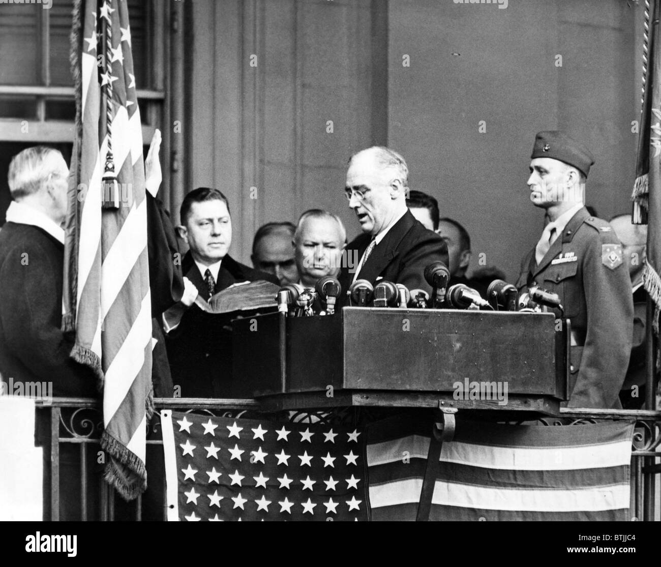 President Franklin D. Roosevelt (1882-1945), is sworn into office for his fourth term. L-R: Edwin A. Halsey, Secretary of the Se Stock Photo
