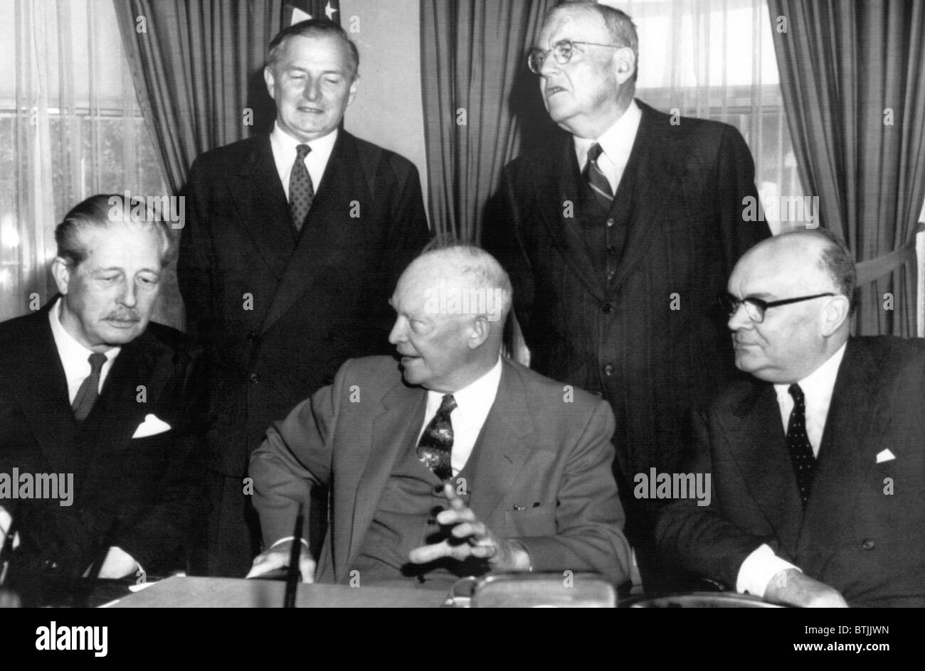 Seated L-R: British Prime Minister Harold MacMillan, U.S. President Dwight Eisenhower, NATO Secretary General Paul-Henri Spaak, Stock Photo