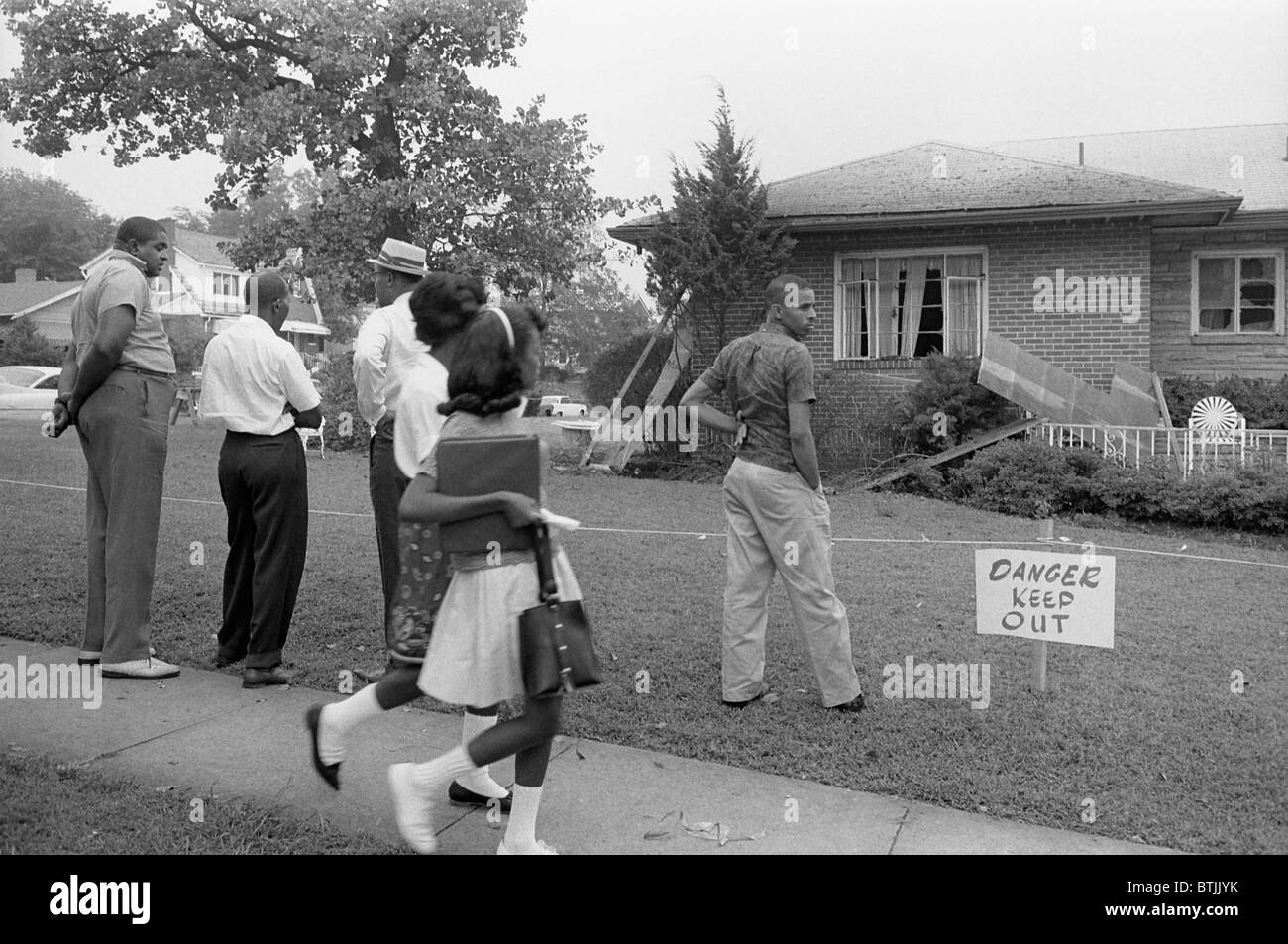 African Americans viewing the bomb-damaged home of Arthur Shores, NAACP attorney, by Marion S. Trikosko, Birmingham, Alabama, September 5, 1963. Stock Photo