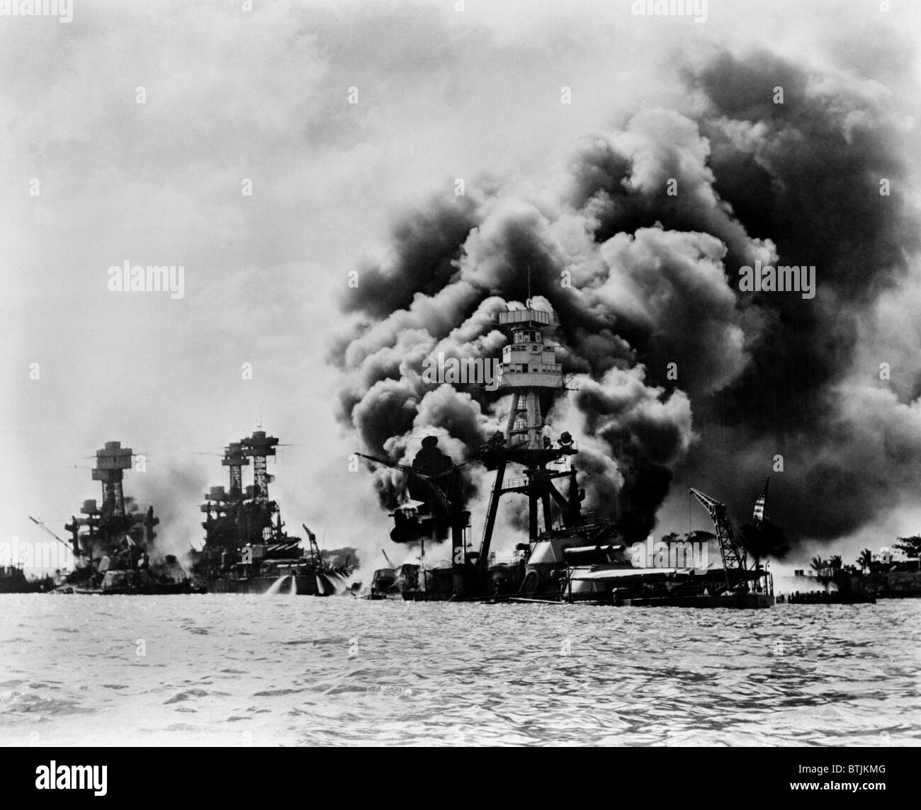 Pearl Harbor: three stricken U.S. battleships. Left to right: U.S.S. West Virginia, severely damaged; U.S.S. Tennessee, damaged; and U.S.S. Arizona, sunk, December 7, 1941 Stock Photo