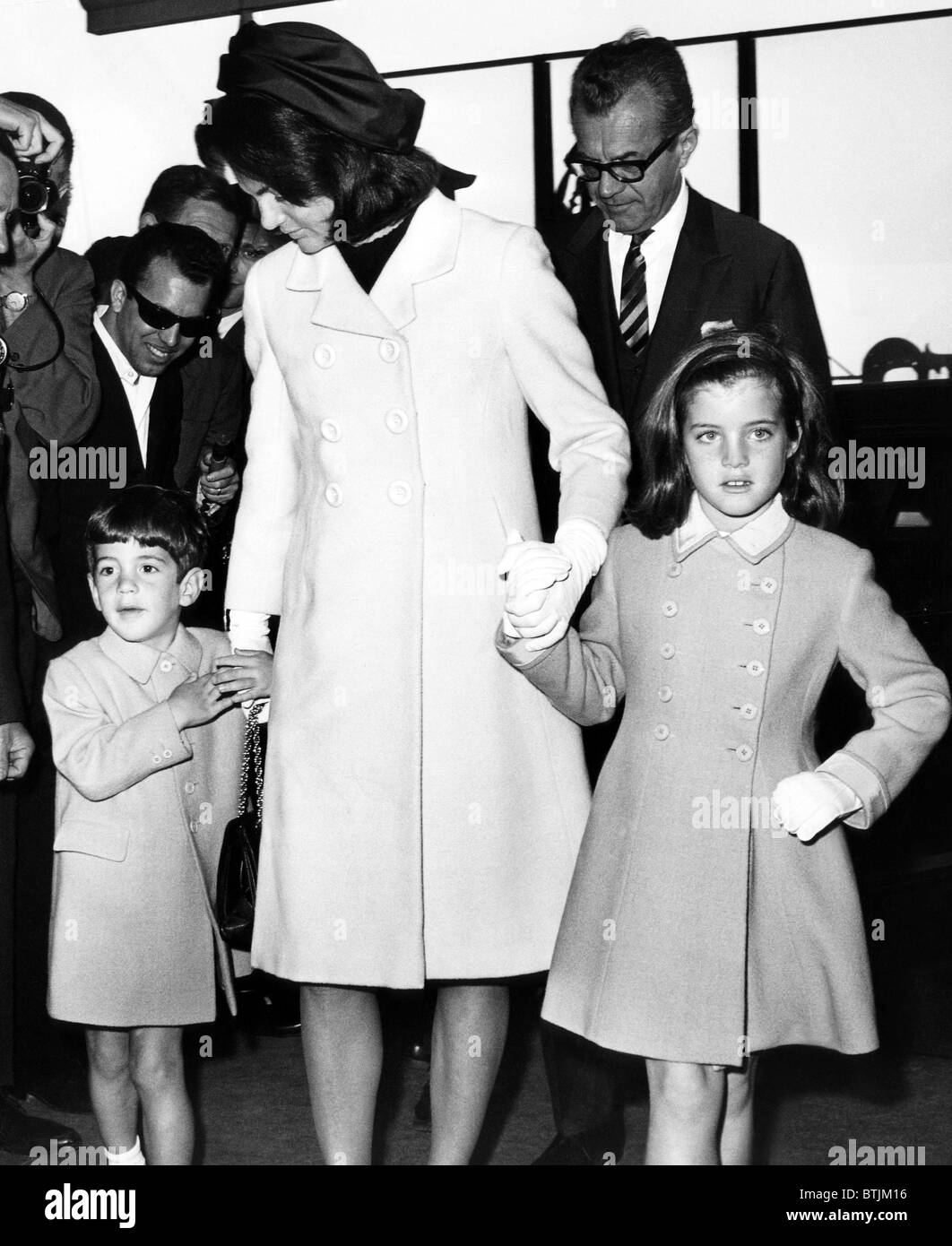 John F. Kennedy Jr., Jacqueline Kennedy, and Caroline Kennedy in the John F. Kennedy International Airport, New York, May 12, 19 Stock Photo