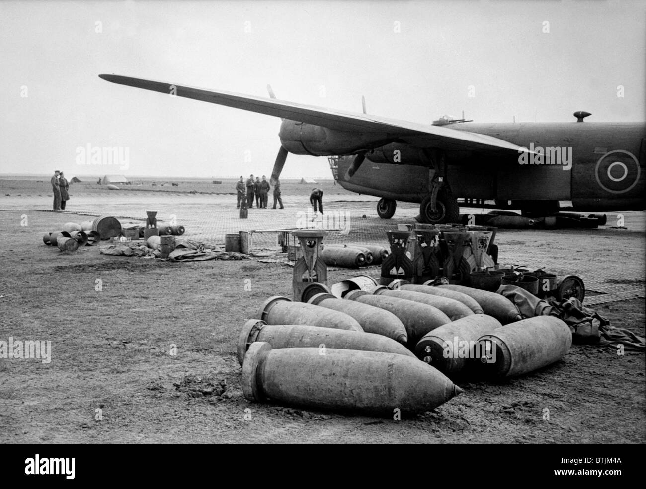 Bombs lie on an Allied airfield ready to be loaded into Royal Air Force Liberators. The British bombers of the Mediterranian Allied Air Forces worked with American Liberators to strangle German supply lines feeding Nazi troops on the Anzio, Cassino and Eighth Army fronts. ca. 1942-1945 Stock Photo