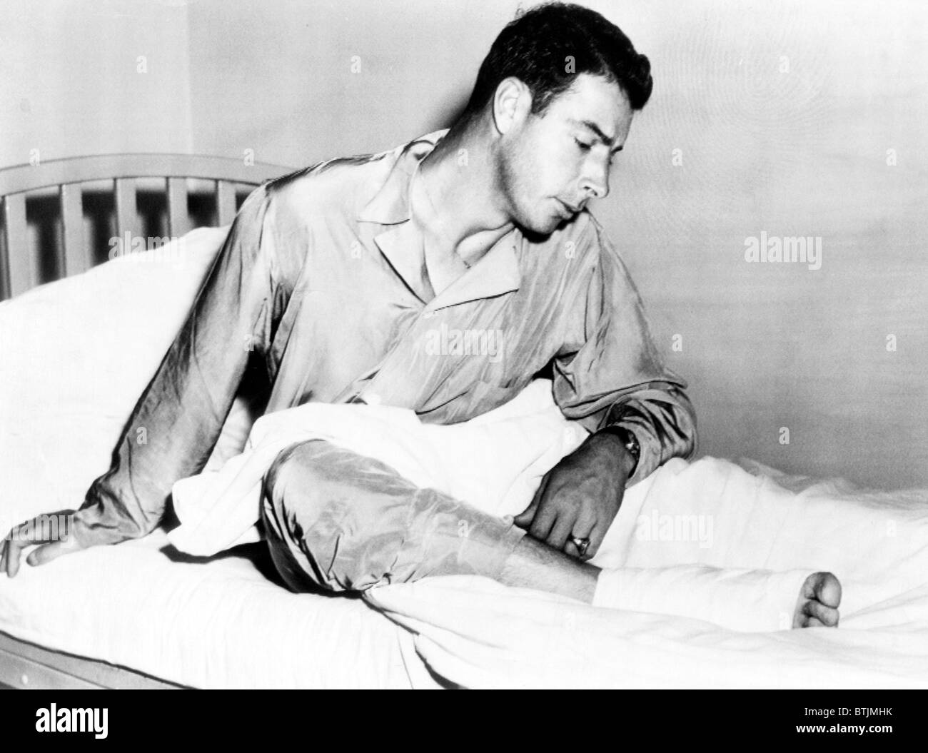 Joe DiMaggio at John Hopkins hospital in Baltimore with a heel injury, 1949. Courtesy: CSU Archives/Everett Collection Stock Photo