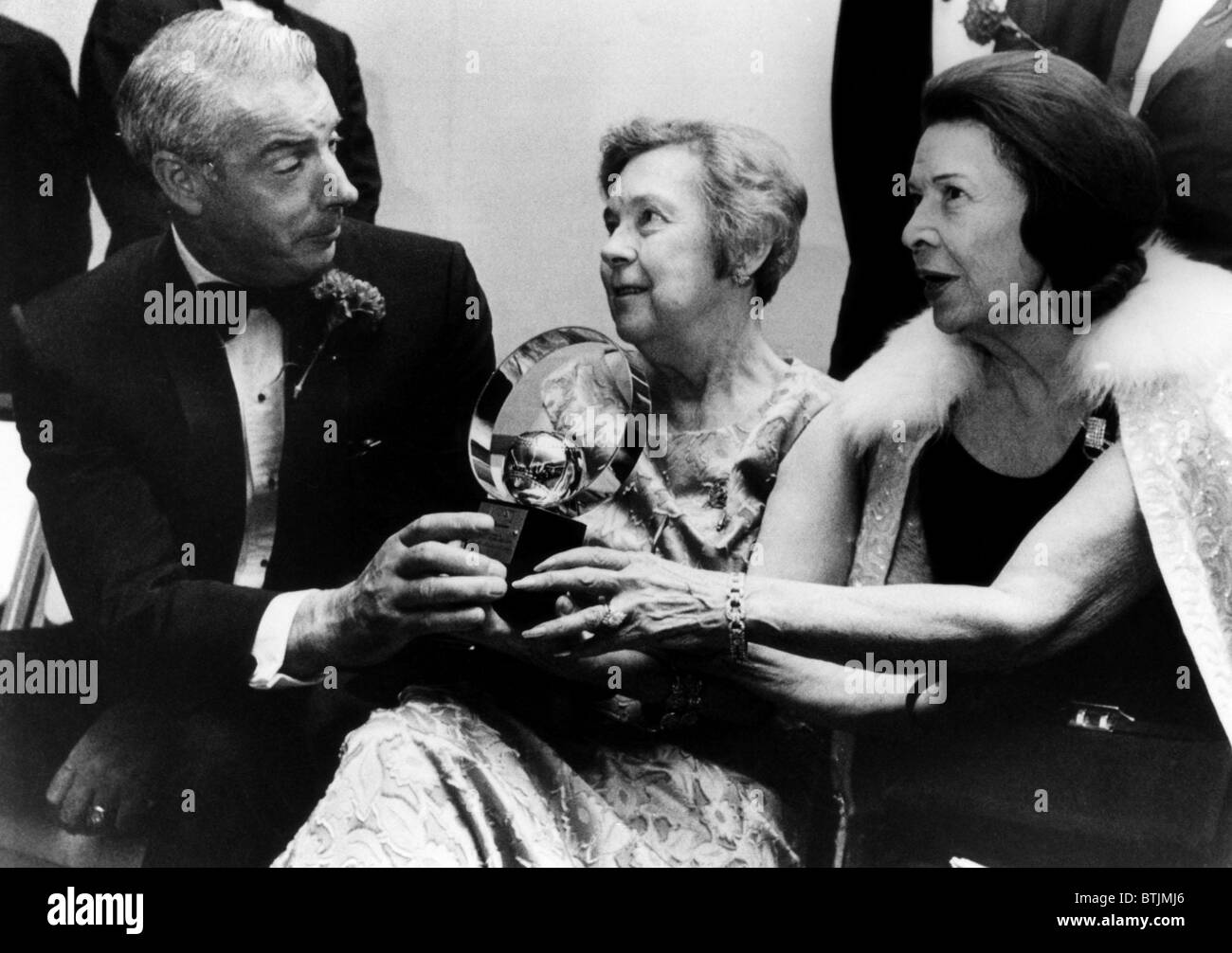 Joe DiMaggio, Eleanor Gehrig and Claire Ruth at the 100th Anniversary All-Star dinner. DiMaggio was named the 'Greatest Living P Stock Photo