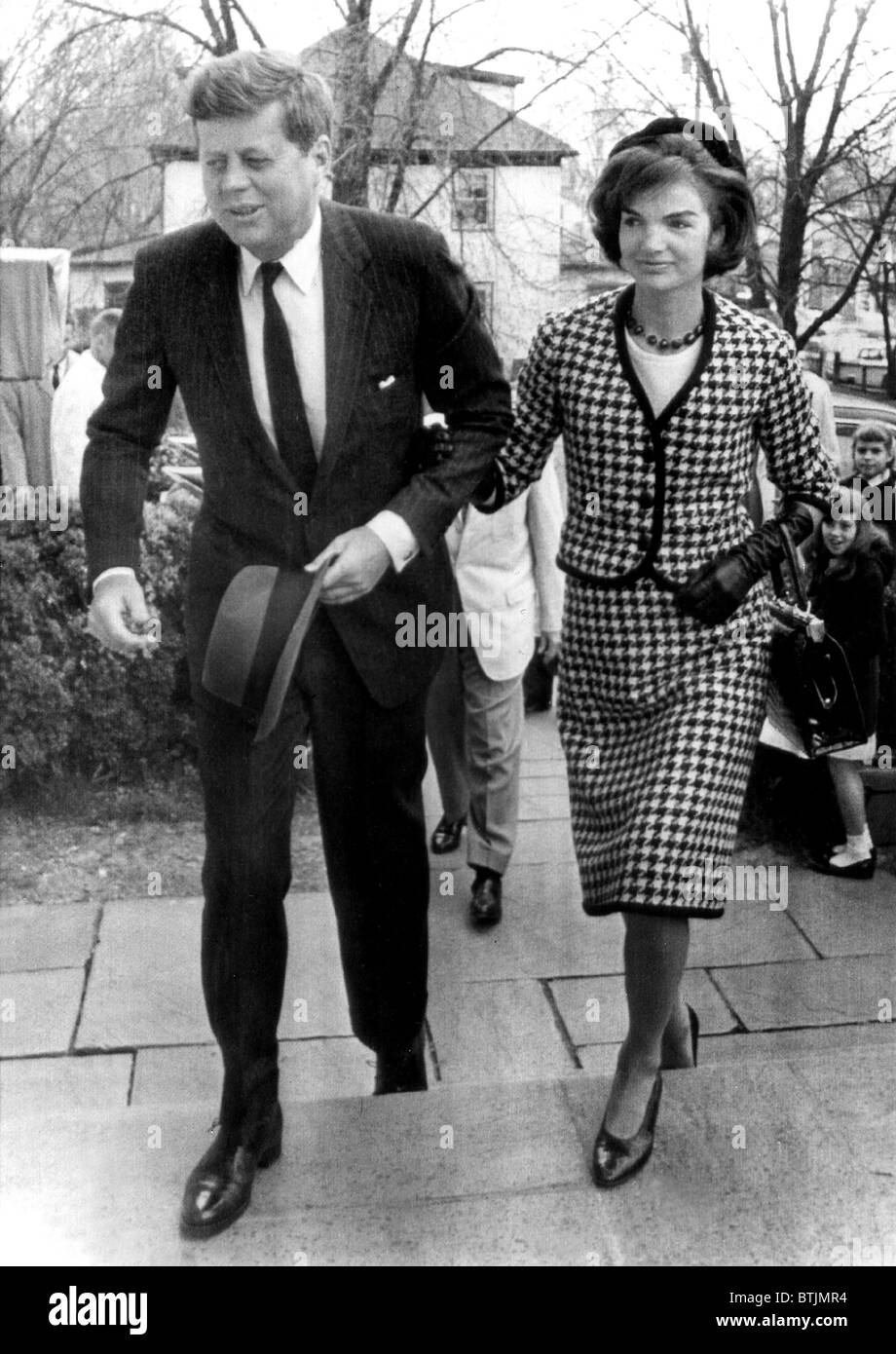 John and Jacqueline Kennedy arrive to attend a mass in Middleburg, VA, 4/9/61. Stock Photo