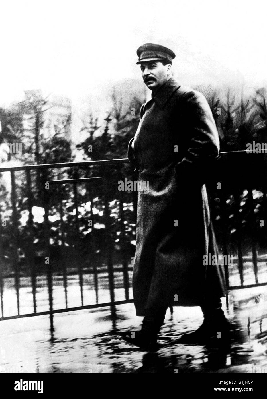 Josef Stalin strolls through Red Square, Moscow, Russia, ca. 1932. Courtesy: CSU Archives/Everett Collection. Stock Photo