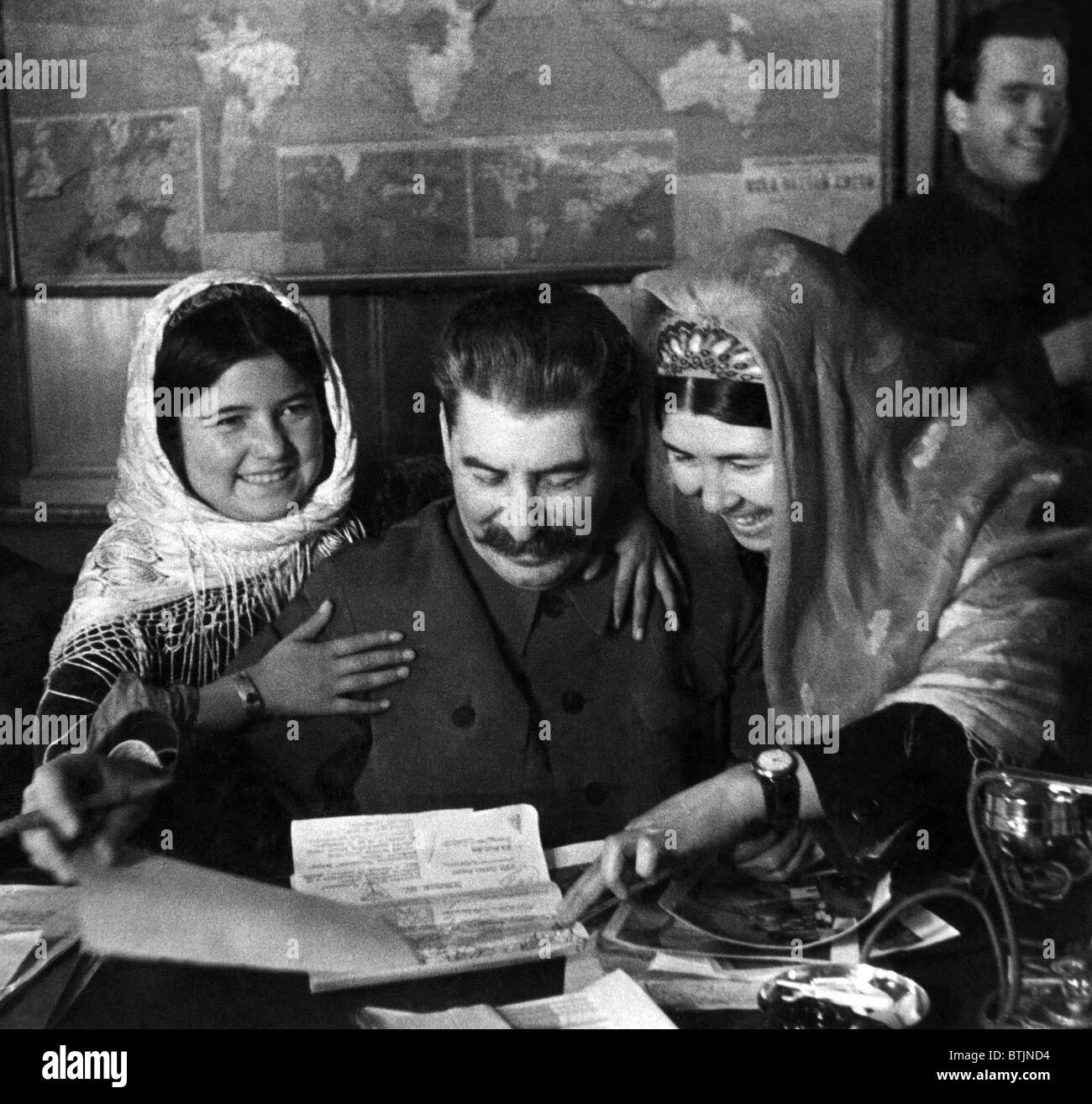 Mamlyakat Nakhangova, Soviet General Secretary Josef Stalin, and Ena Geldieva, at a conference for members of collective farms o Stock Photo