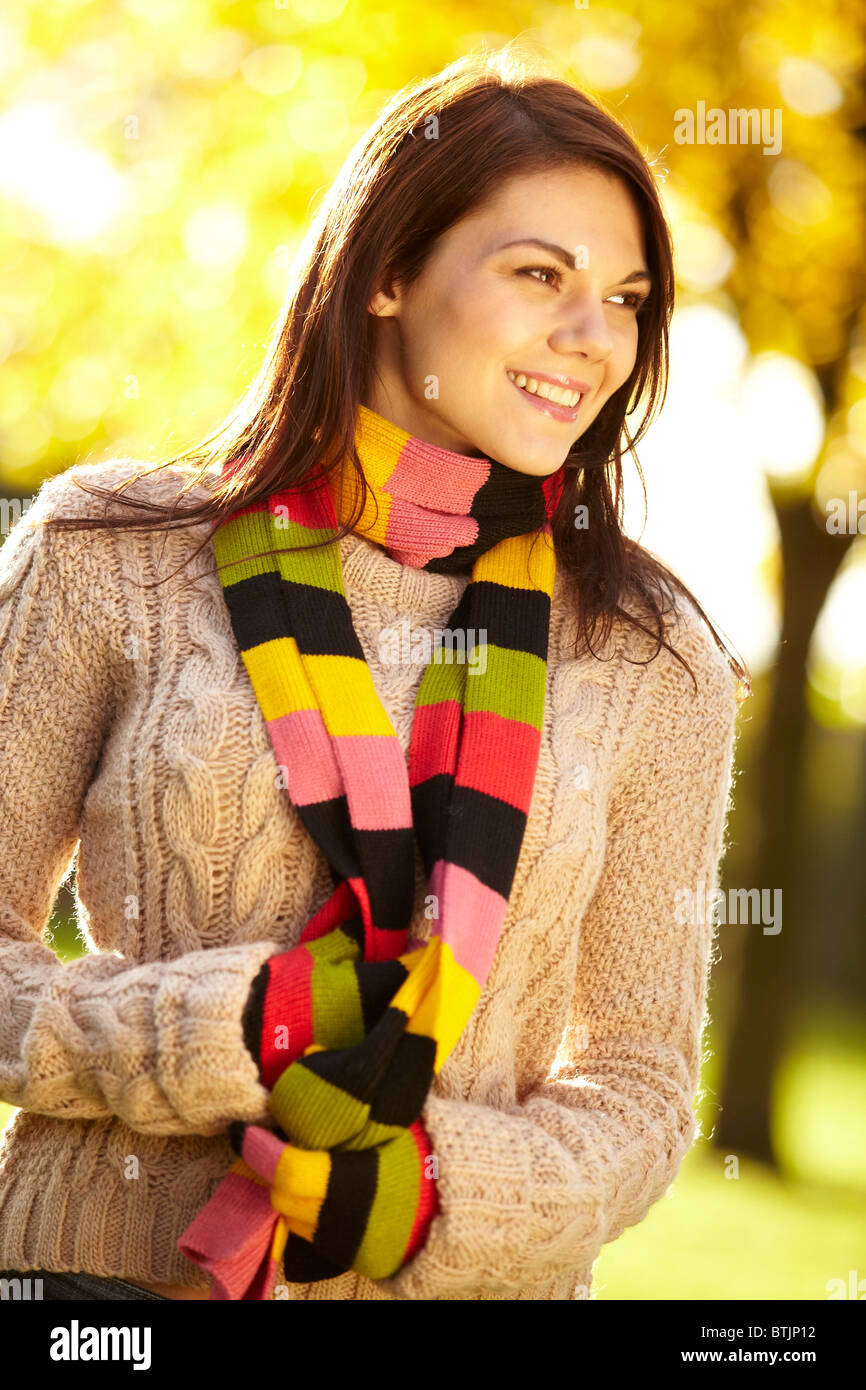 Girl wearing jumper and scarf Stock Photo Alamy