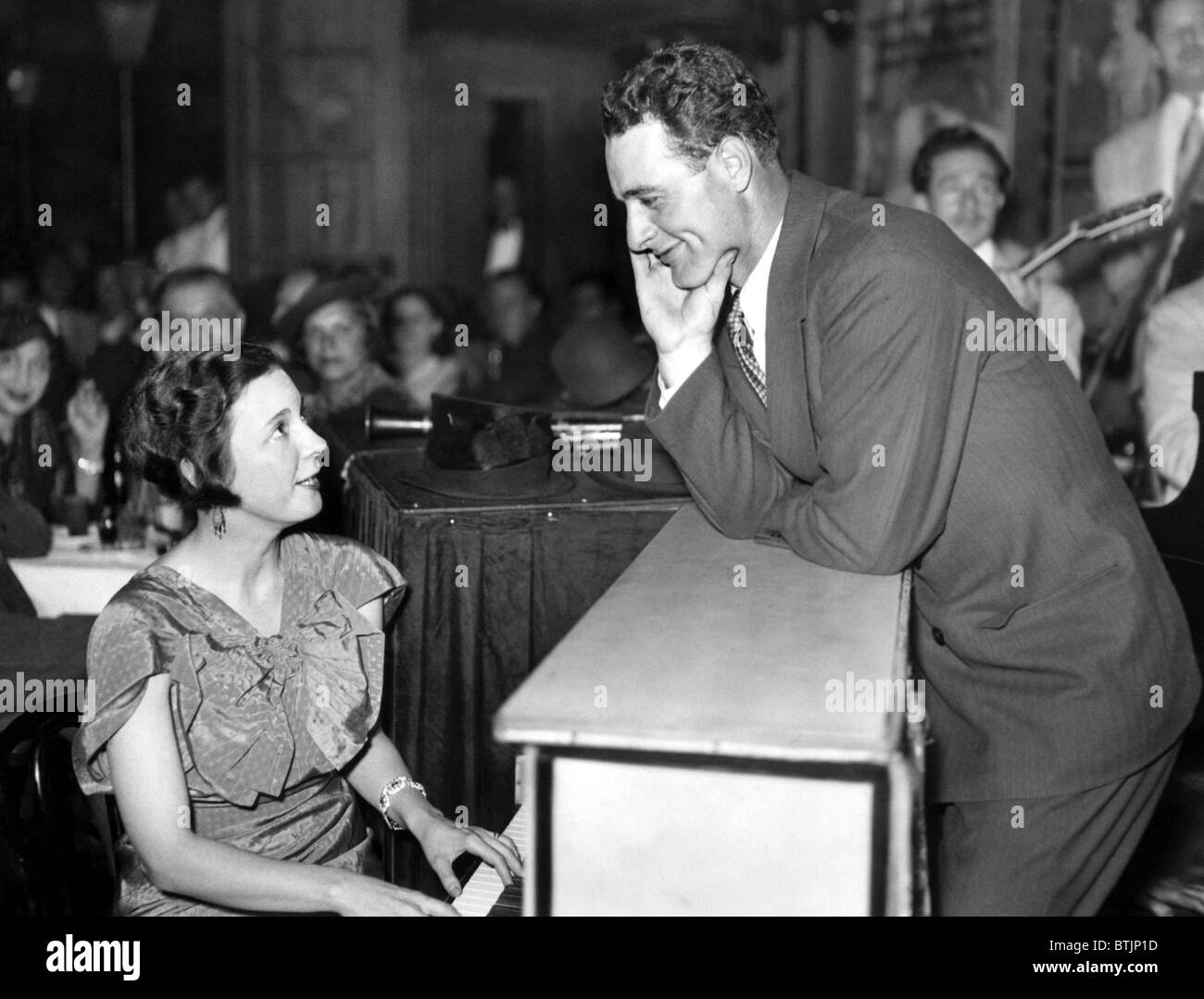 Eleanor Gehrig sings her own composition, 'I Can't Get To First Base Without You' to her husband Lou Gehrig during their visit t Stock Photo