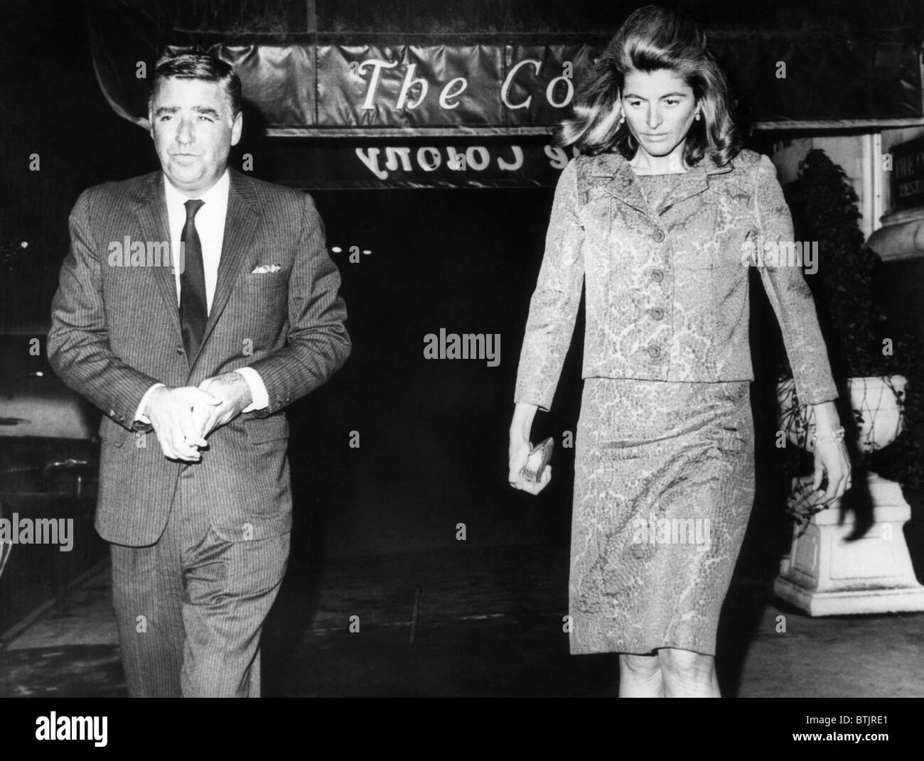 Peter Lawford, and his ex-wife Patricia Kennedy, days after their divorce in Idaho. They are exiting a New York restaurant after Stock Photo