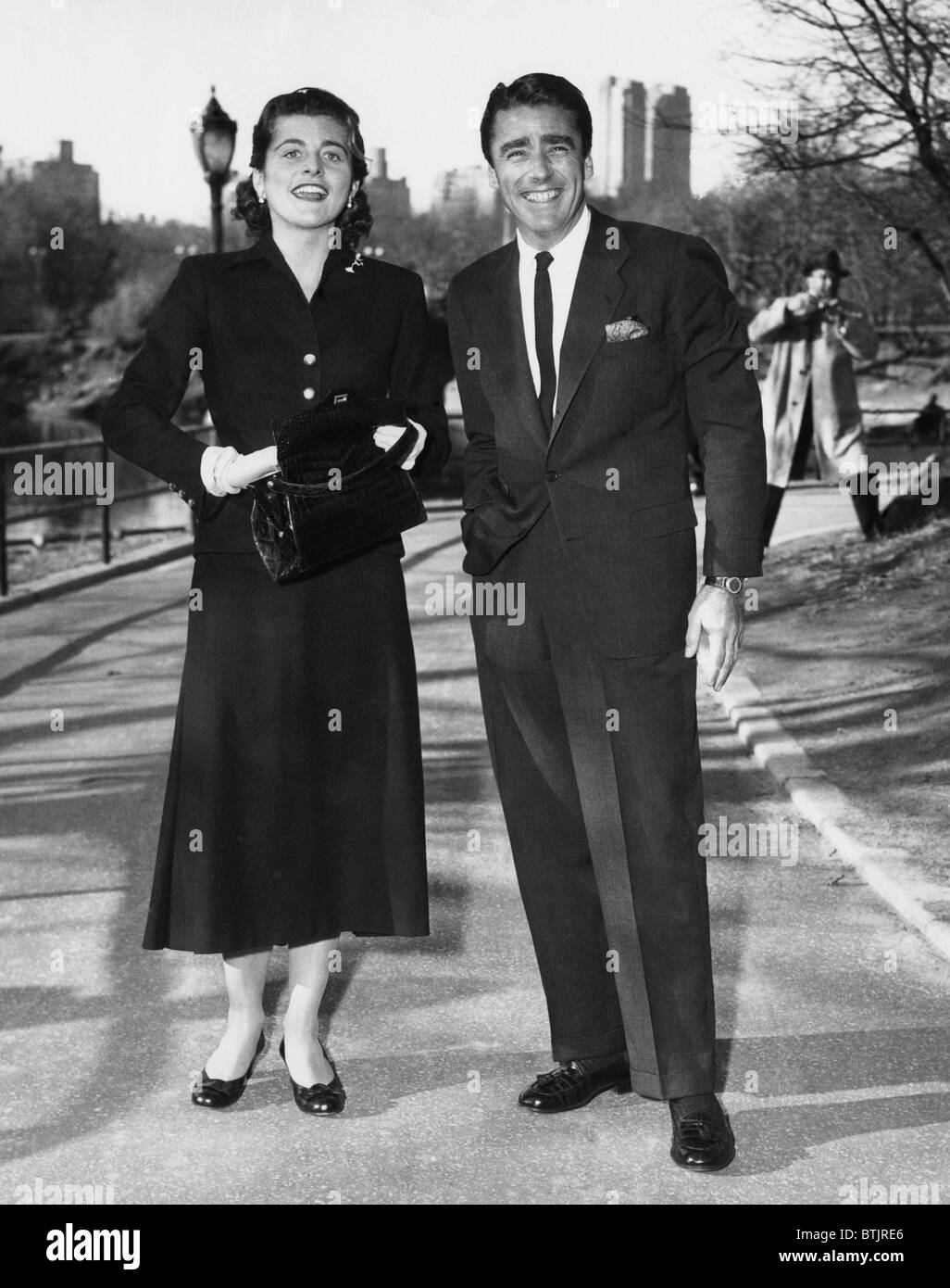 Patricia Kennedy, and Peter Lawford in Central Park, pose for their first picture since announcing their engagement. February 18 Stock Photo