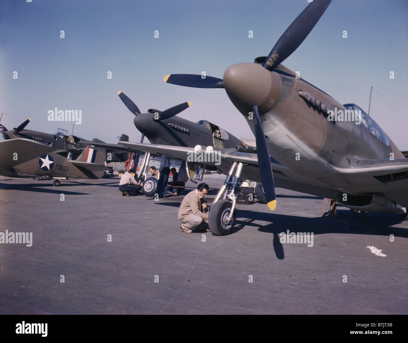 World War II, P-51 mustang fighter planes being prepared for test flight at the field of the North American Aviation Inc. Plant, photograph by Alfred T. Palmer, Inglewood, California, October, 1942. Stock Photo