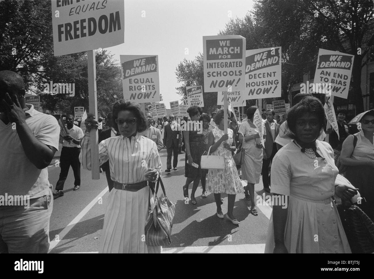 Civil rights march on Washington DC, a procession of African Americans carrying signs for equal rights, integrated schools, decent housing, and an end to bias, photograph by Warren K. Leffler, August 28, 1963. Stock Photo