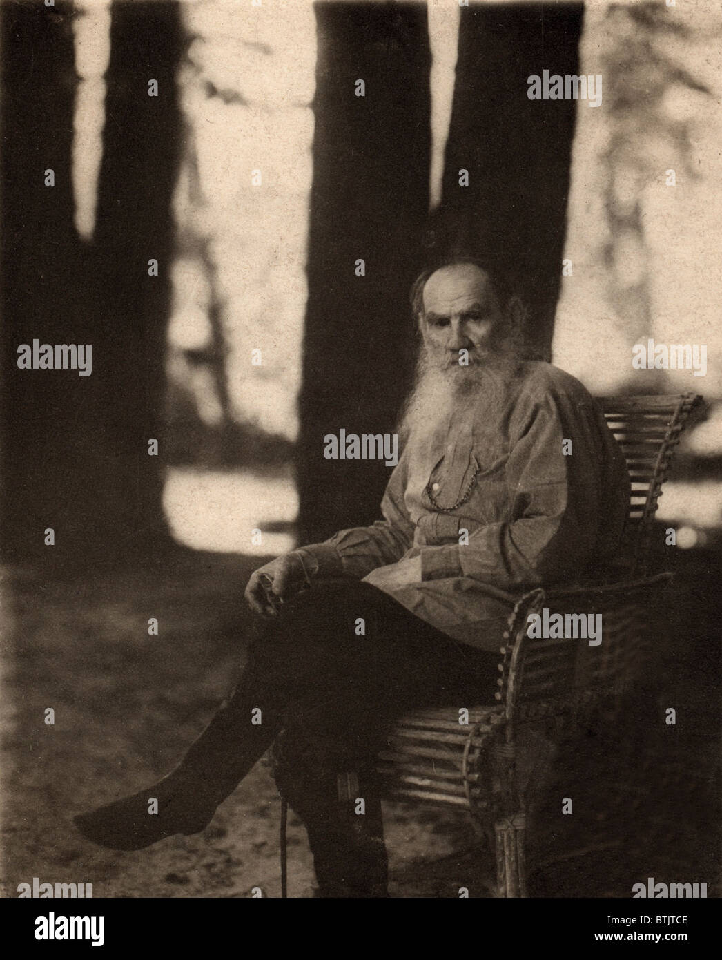 Leo Tolstoy (1828-1910) Russian novelist, seated outdoors at the Tolstoy estate in Iasnaia Poliana, 1908. Stock Photo