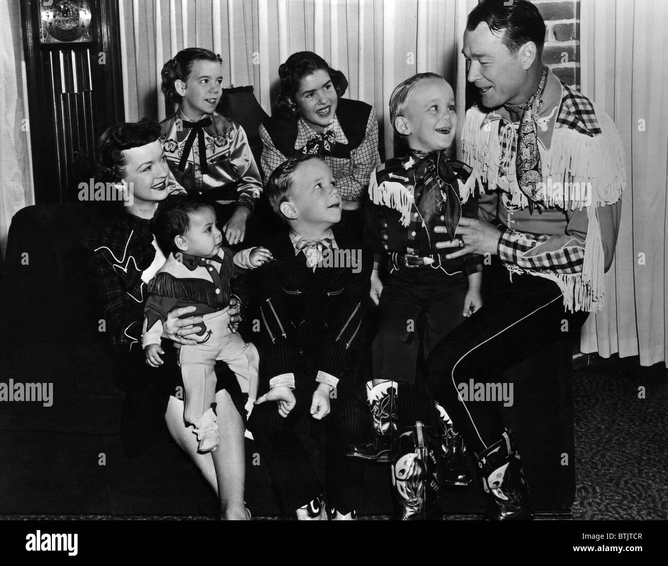 Roy Rogers (right), and his wife Dale Evans (left), with their family, c. 1950's. Stock Photo