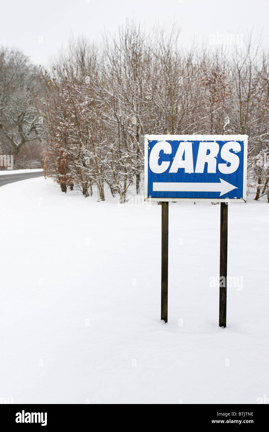 'Cars' road sign in winter snow scene, January 2010 at a service station, England, UK Stock Photo