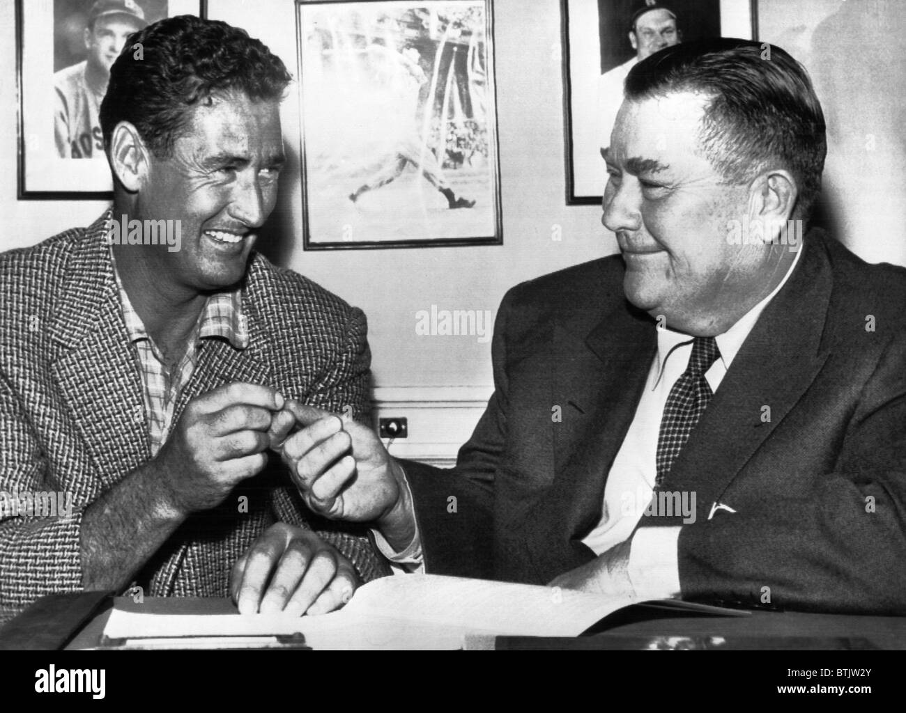 Ted Williams, and Tom Yawkey, owner of the Boston Red Sox agreeing on a contract, circa 1956. CSU Archives Courtesy Everett Coll Stock Photo