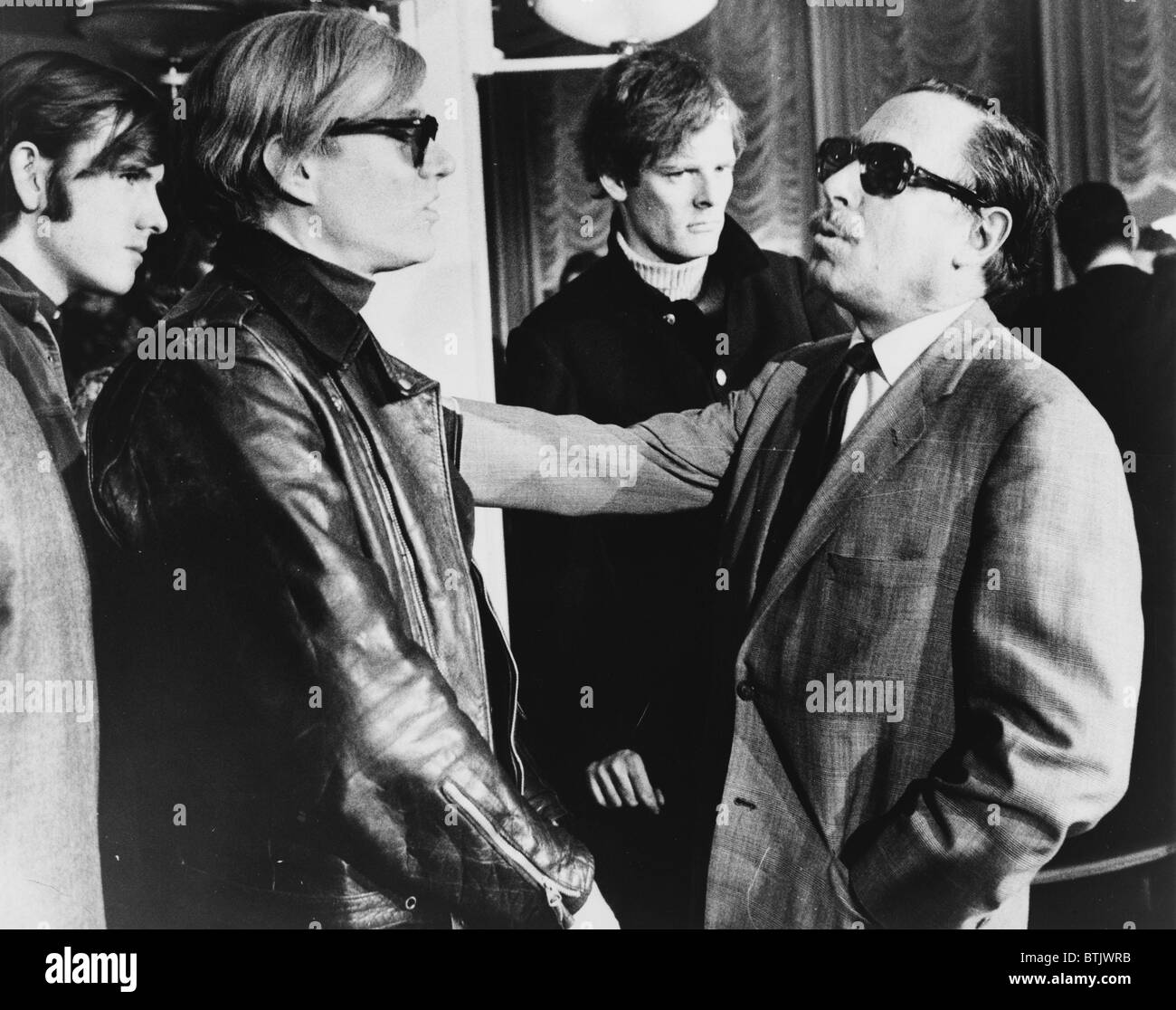 Andy Warhol (left) and Tennessee Williams (right) talking on the S.S. France, 1967. Stock Photo