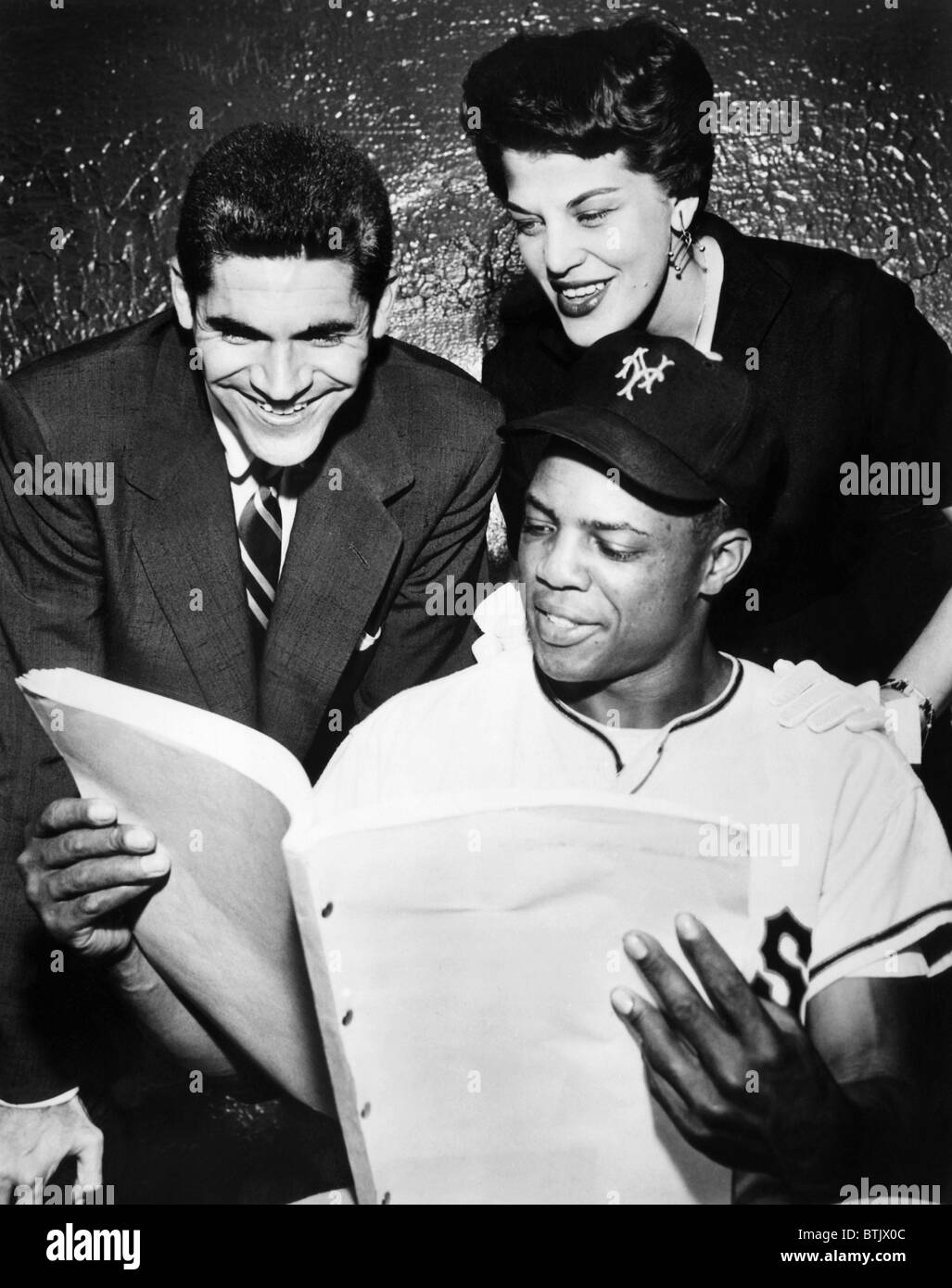 Ronny Graham, Kaye Ballard, New York Yankee Willie Mays (seated), c. 1954. Stock Photo