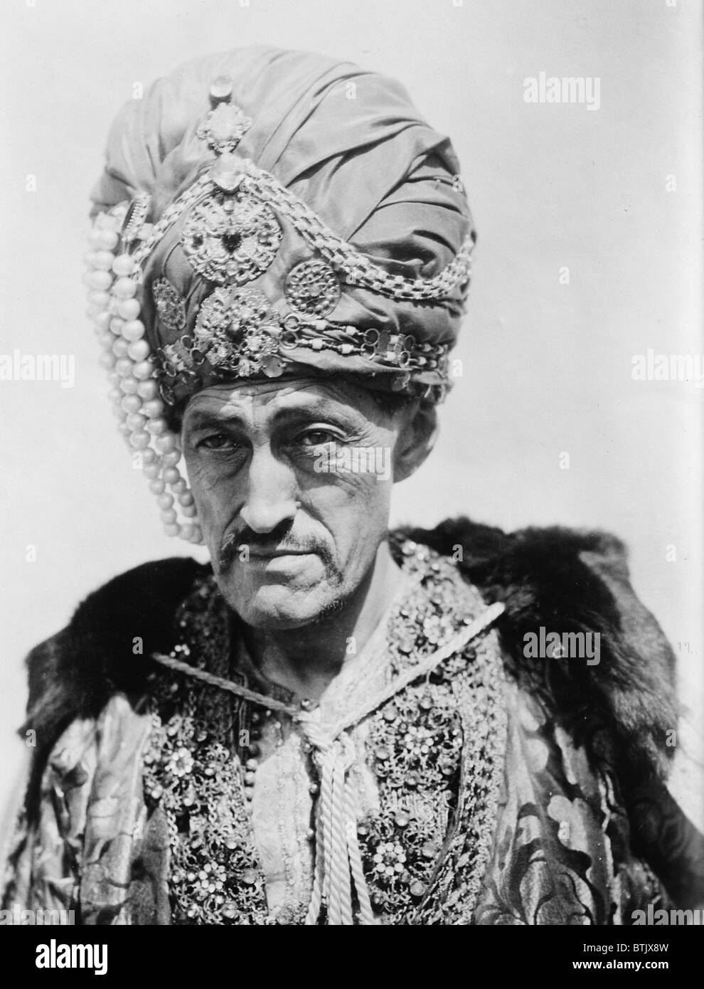 Sadakichi Hartmann (1867-1944), writer of German-Japanese ancestry, immigrated to the US as a child. The 'King of Bohemia' is dressed in an exotic costume. Ca. 1925. Stock Photo