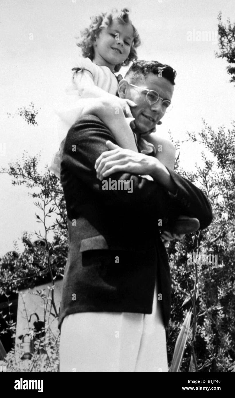 Shirley Temple being carried by her brother Jack Temple, 7/21/34
