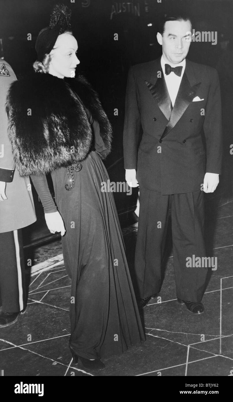 Erich Maria Remarque (1898-1970) with Marlene Dietrich (1901-1992), arriving at Hollywood premiere of 'Pinocchio' in 1940. Both Stock Photo