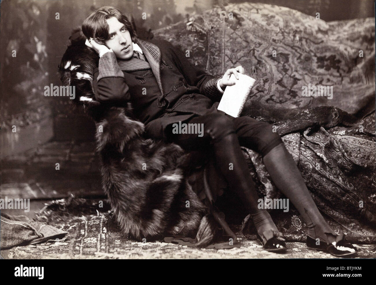 Oscar Wilde, (1854-1900) Irish literary author of, THE PORTRAIT OF DORIAN GRAY (1891), LADY WINDERMERE'S FAN (1892), and THE IMPORTANCE OF BEING EARNEST (1895). 1882 studio portrait by Napoleon Sarony. Stock Photo