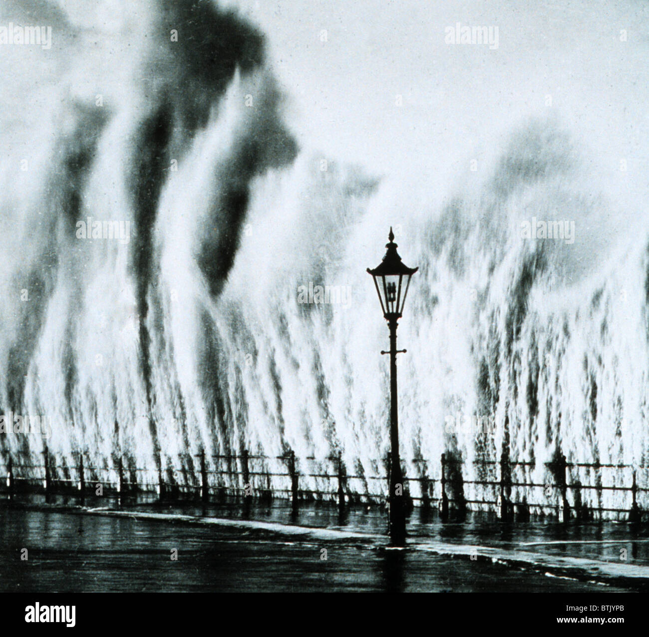 New England Hurricane. Waves striking a seawall on th New England coast give the appearance of geysers erupting. September 1938 Stock Photo