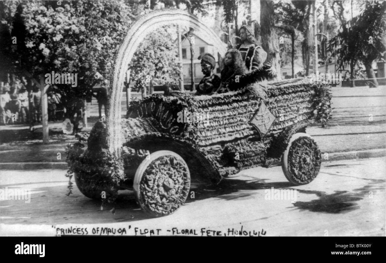 Three Hawaiians in car used as a float in flower festival parade, Princess of Mauoa float, floral fete, Honolulu, photograph, March 18, 1909. Stock Photo
