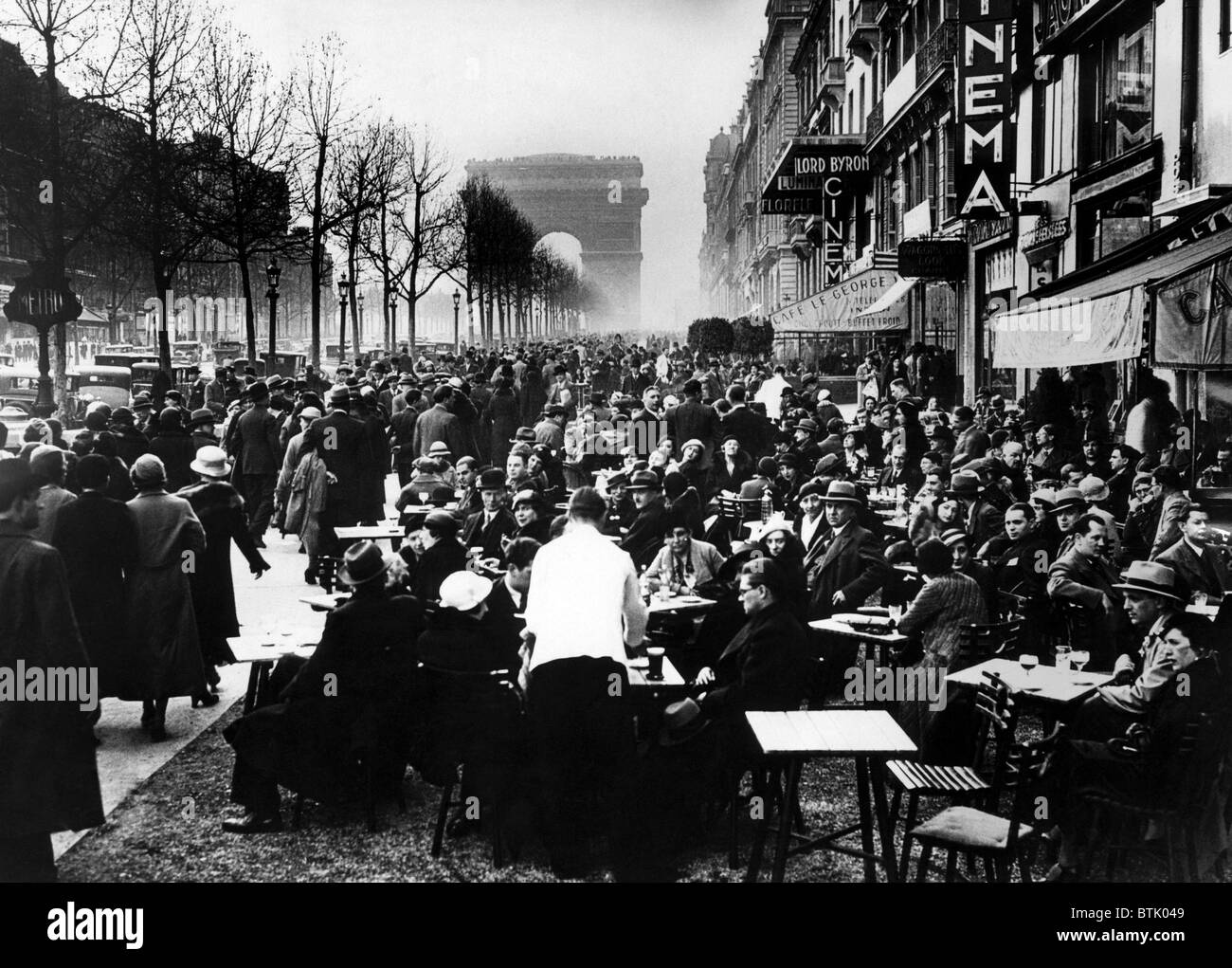 Easter Monday on the Champs Elysees with customers at Apertif hour. 4/10/34. Courtesy: CSU Archives/Everett Collection. Stock Photo